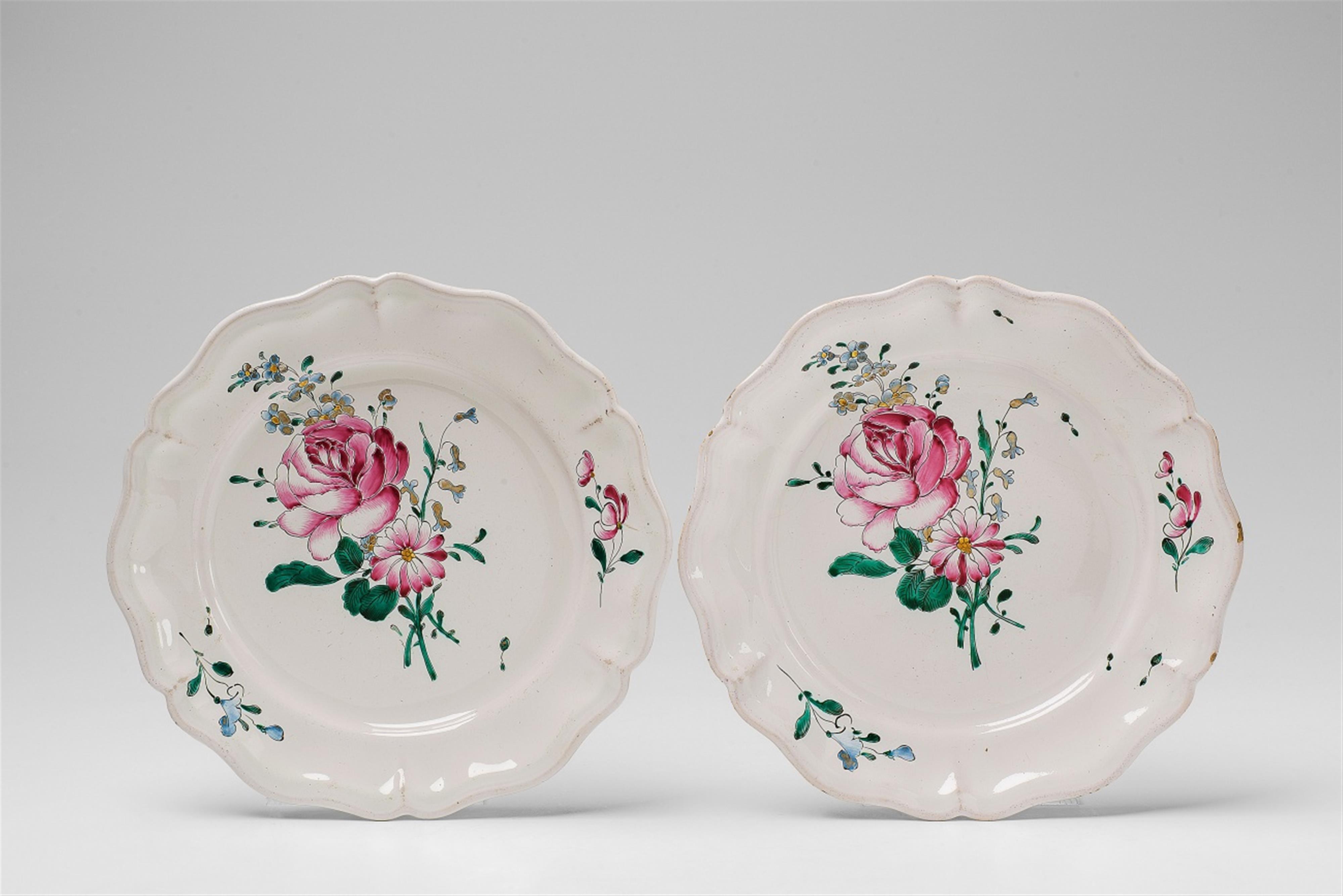 A pair of Strasbourg faience plates with floral decor - image-1