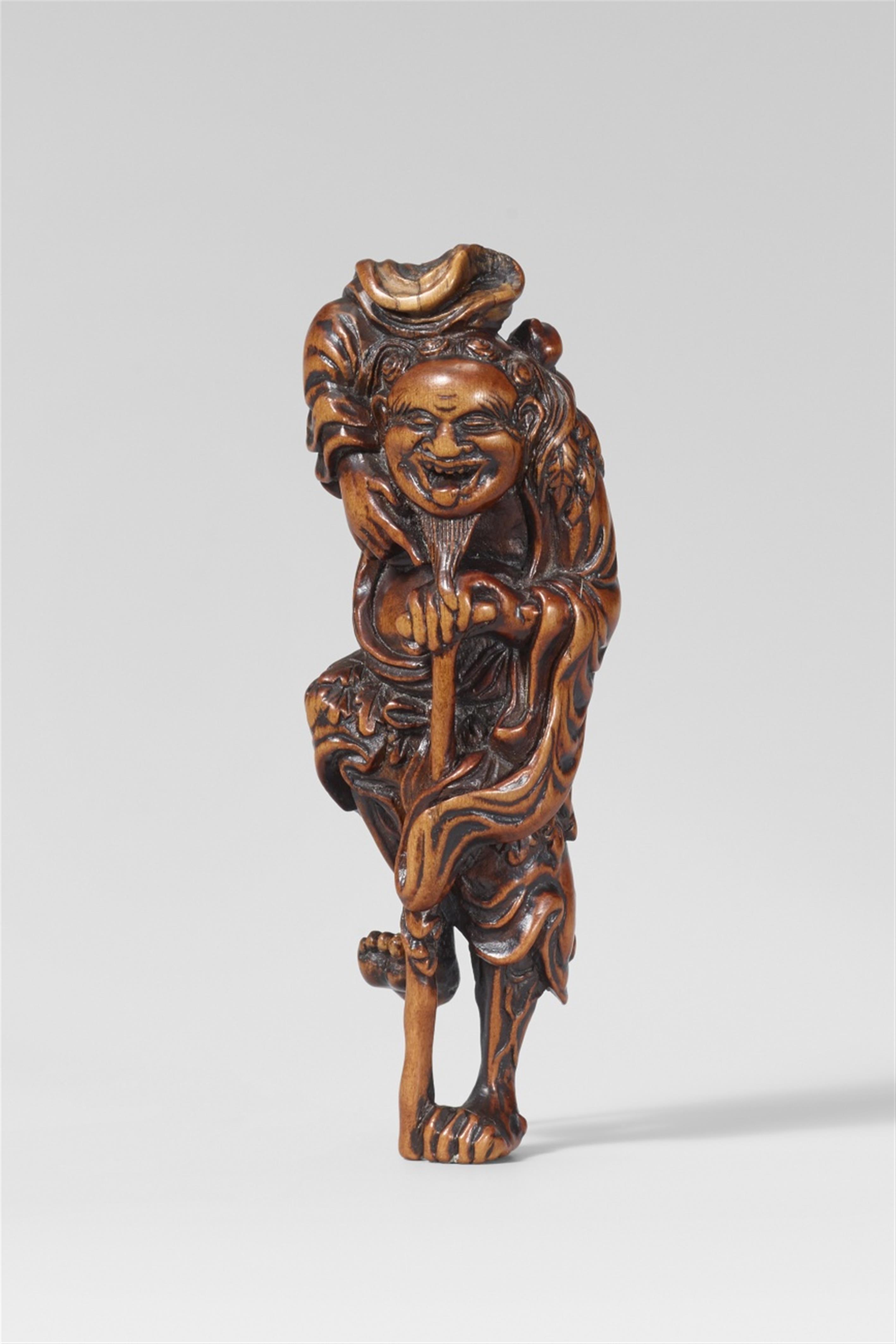 A boxwood netsuke of a laughing Tekkai Sennin with a crutch. First half 19th century - image-1