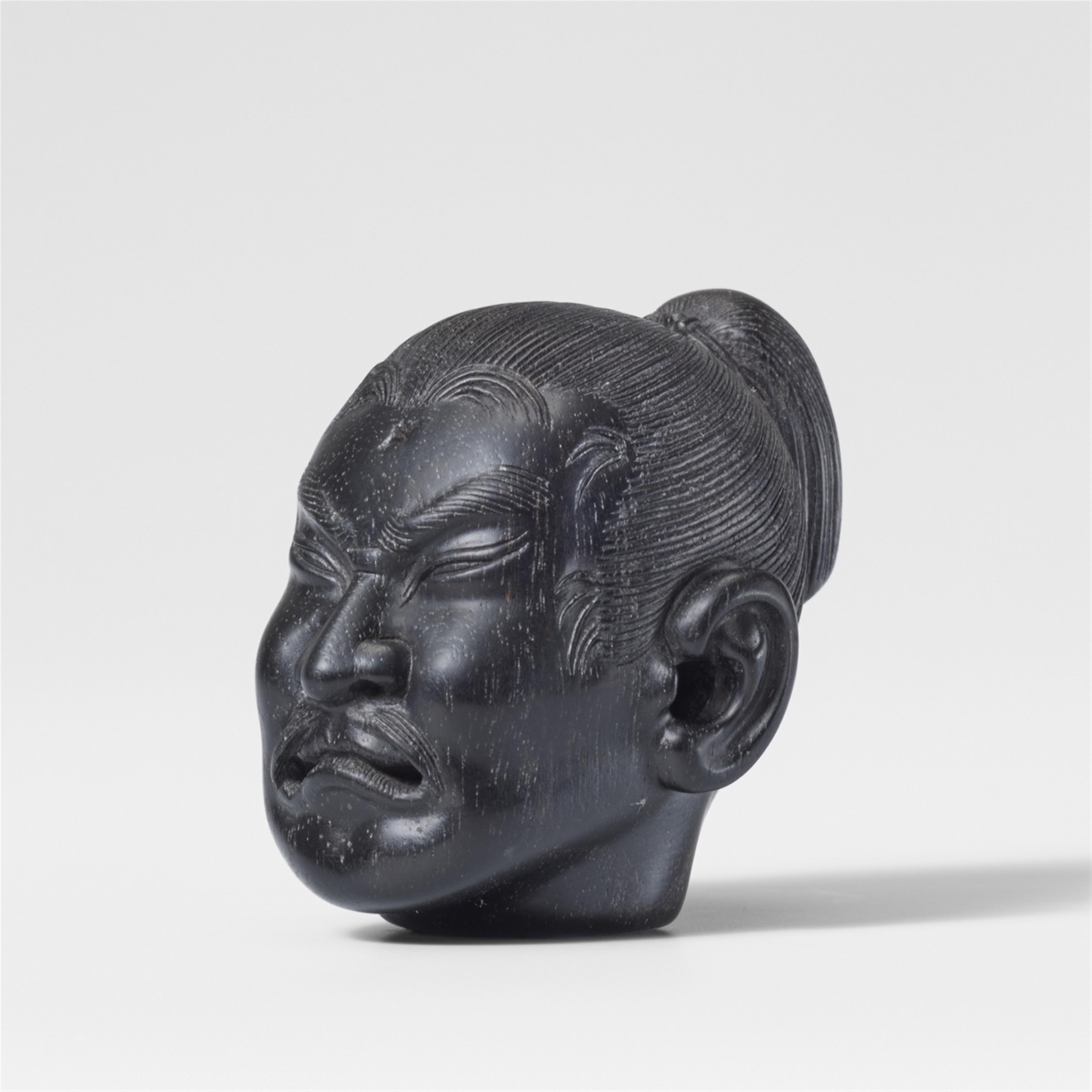 An ebony netsuke of Nitta no Yoshisada’s severed head. 19th century - image-1