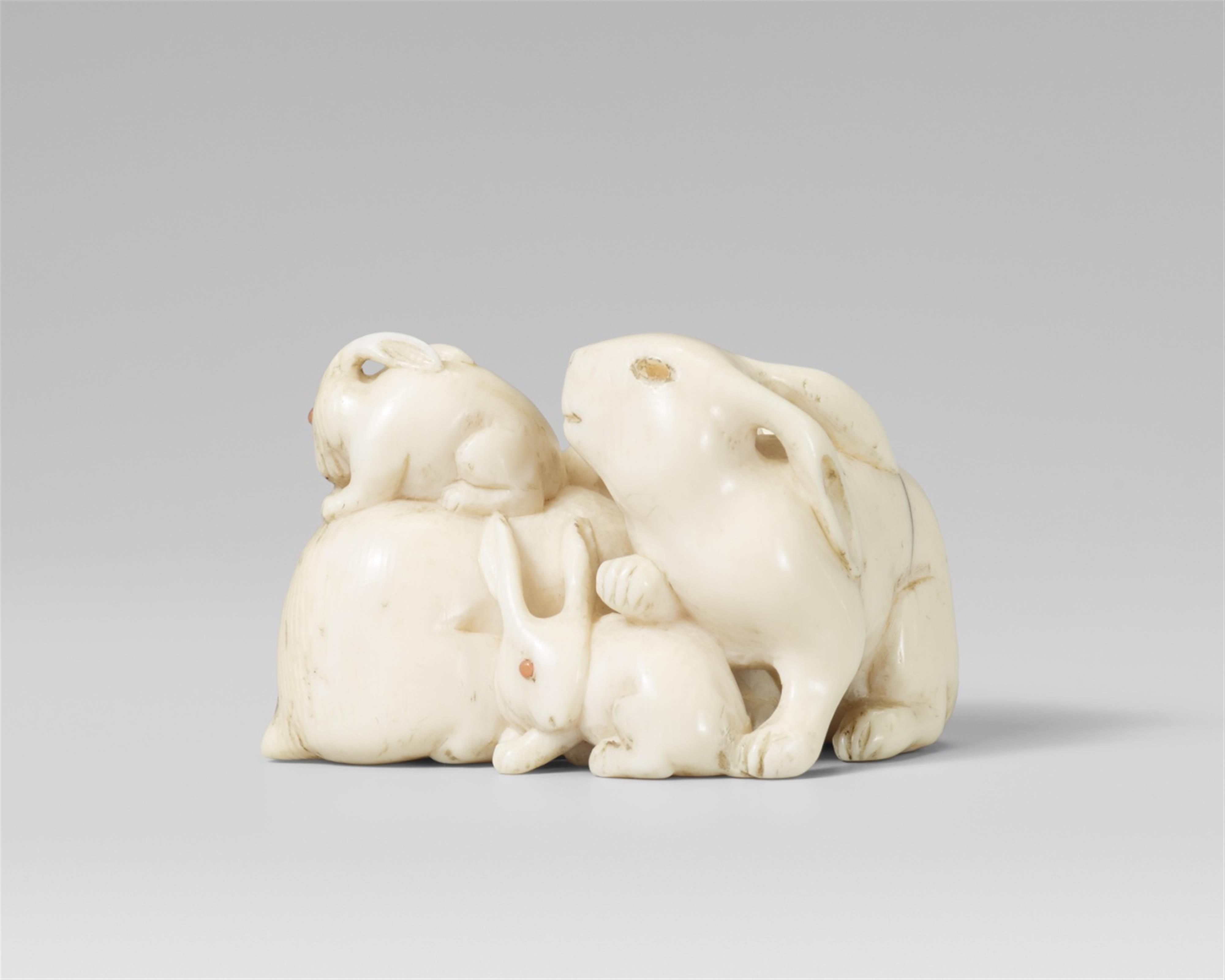 An ivory netsuke of four hares, by Tomotane. Mid-19th century - image-1