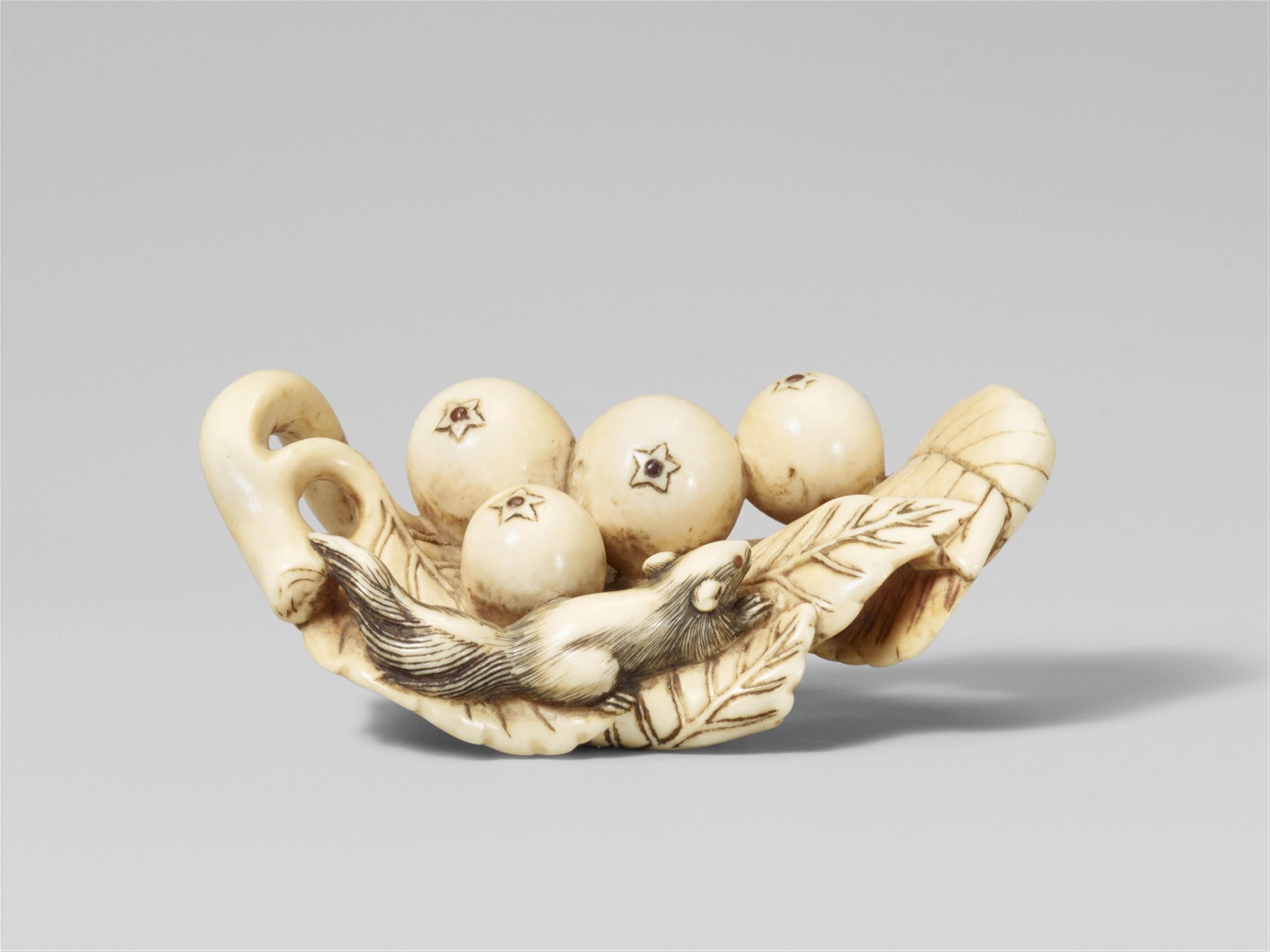 An ivory netsuke of a group of loquat and a squirrel. Early 19th century - image-1