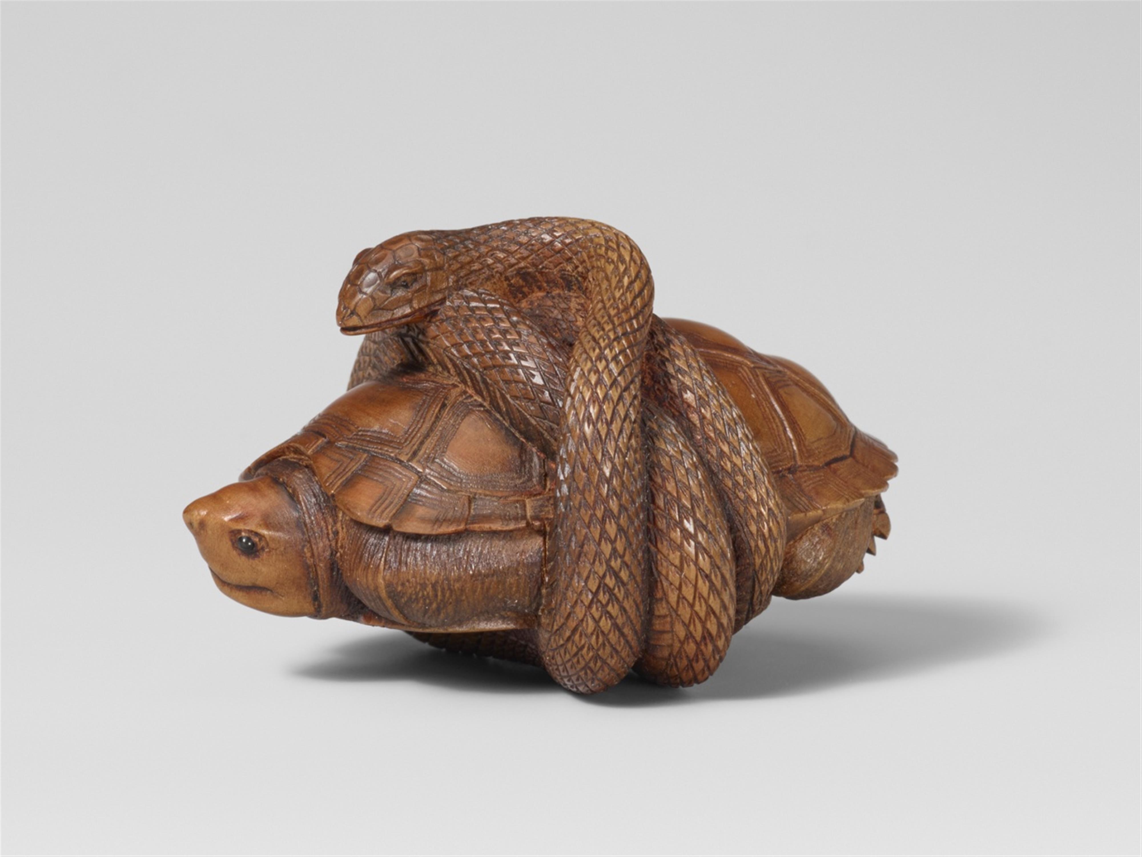 A boxwood netsuke of a snake encircled a tortoise, by Masatami. Late 19th century - image-1