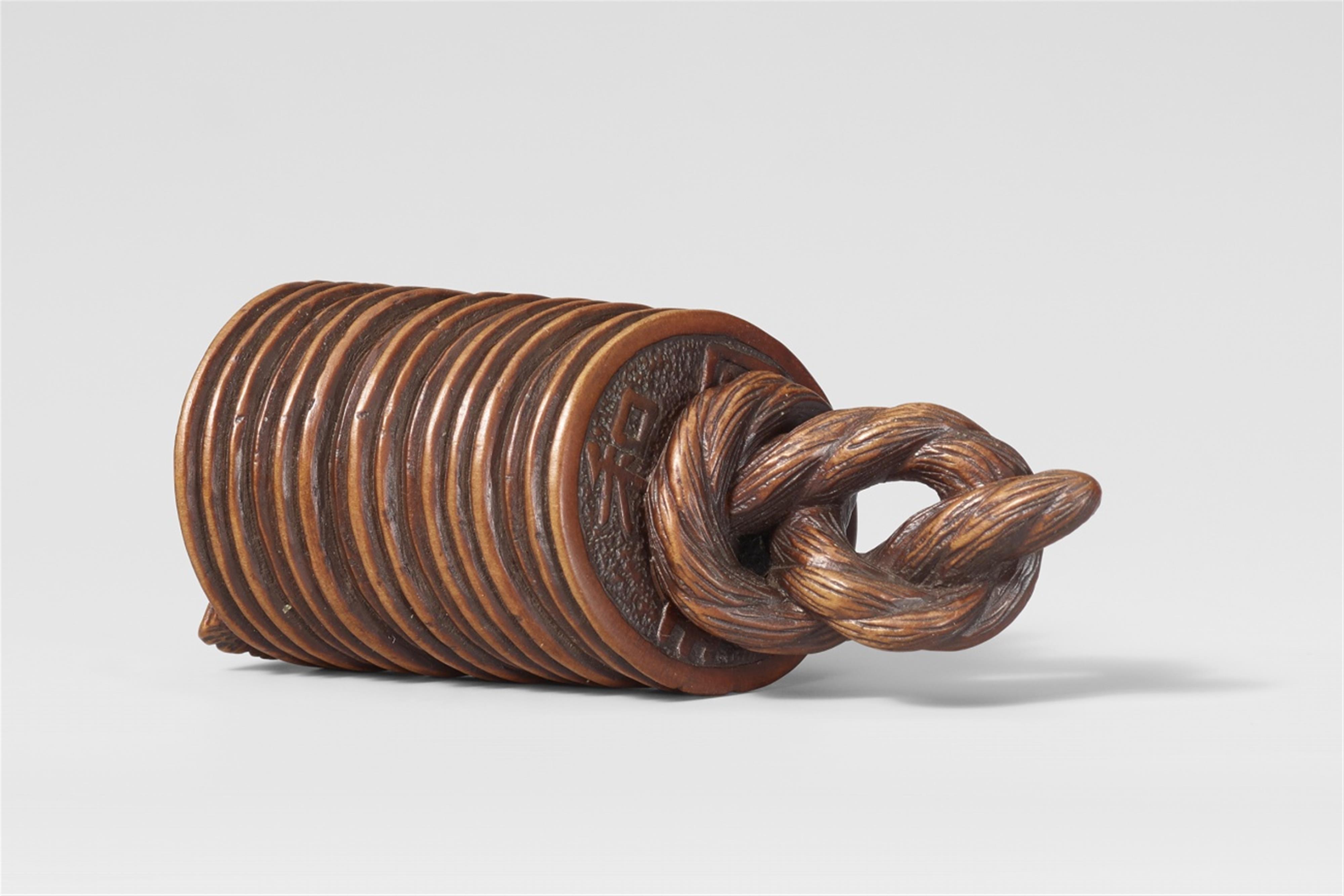 A wood netsuke of coins. 19th century - image-1