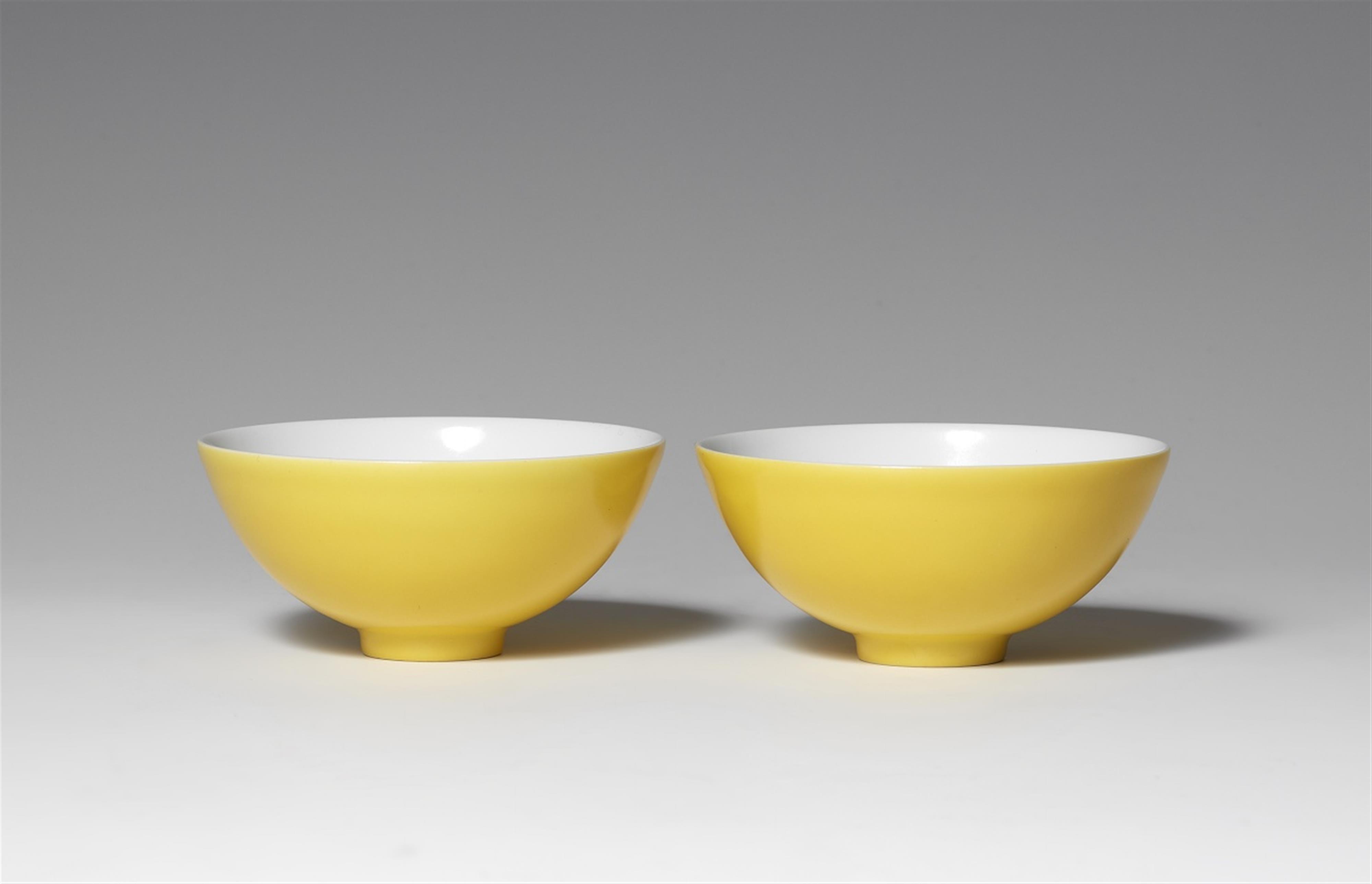 A pair of lemon-yellow-glazed bowls - image-1