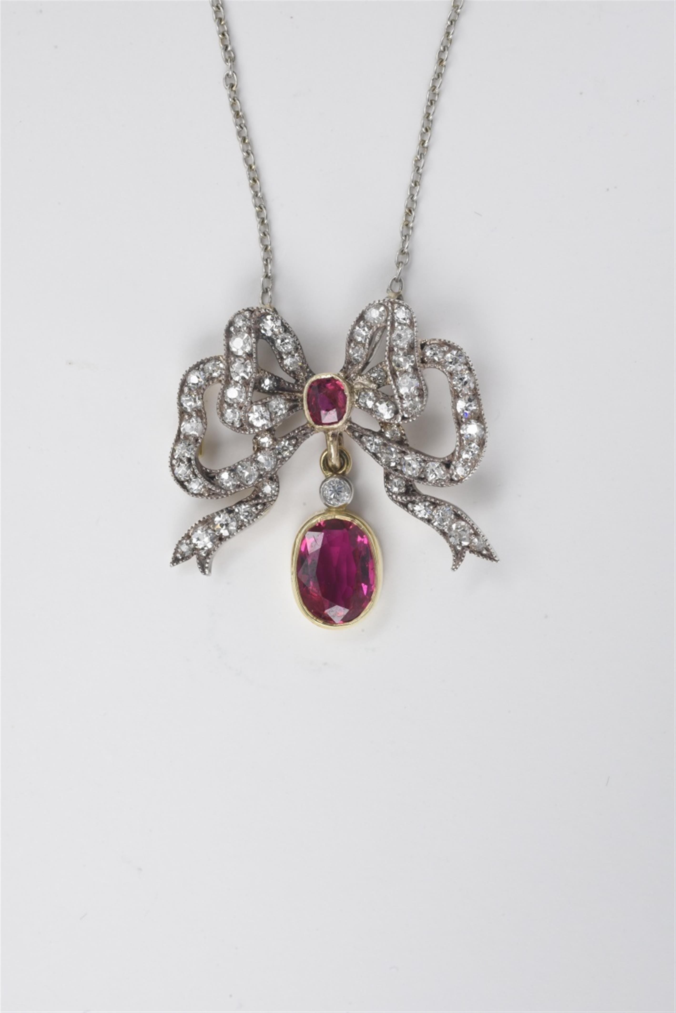 A 14k gold, diamond and ruby bow collier - image-1