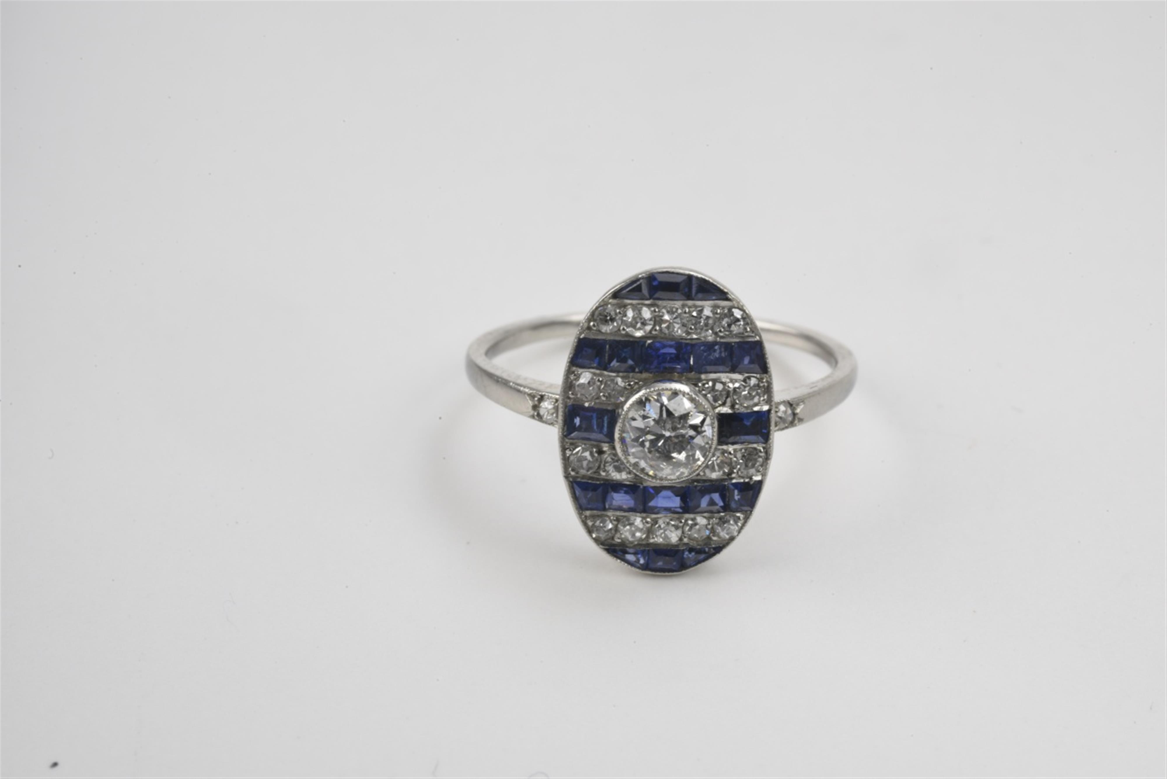 A French Art Deco platinum, diamond and sapphire ring - image-1
