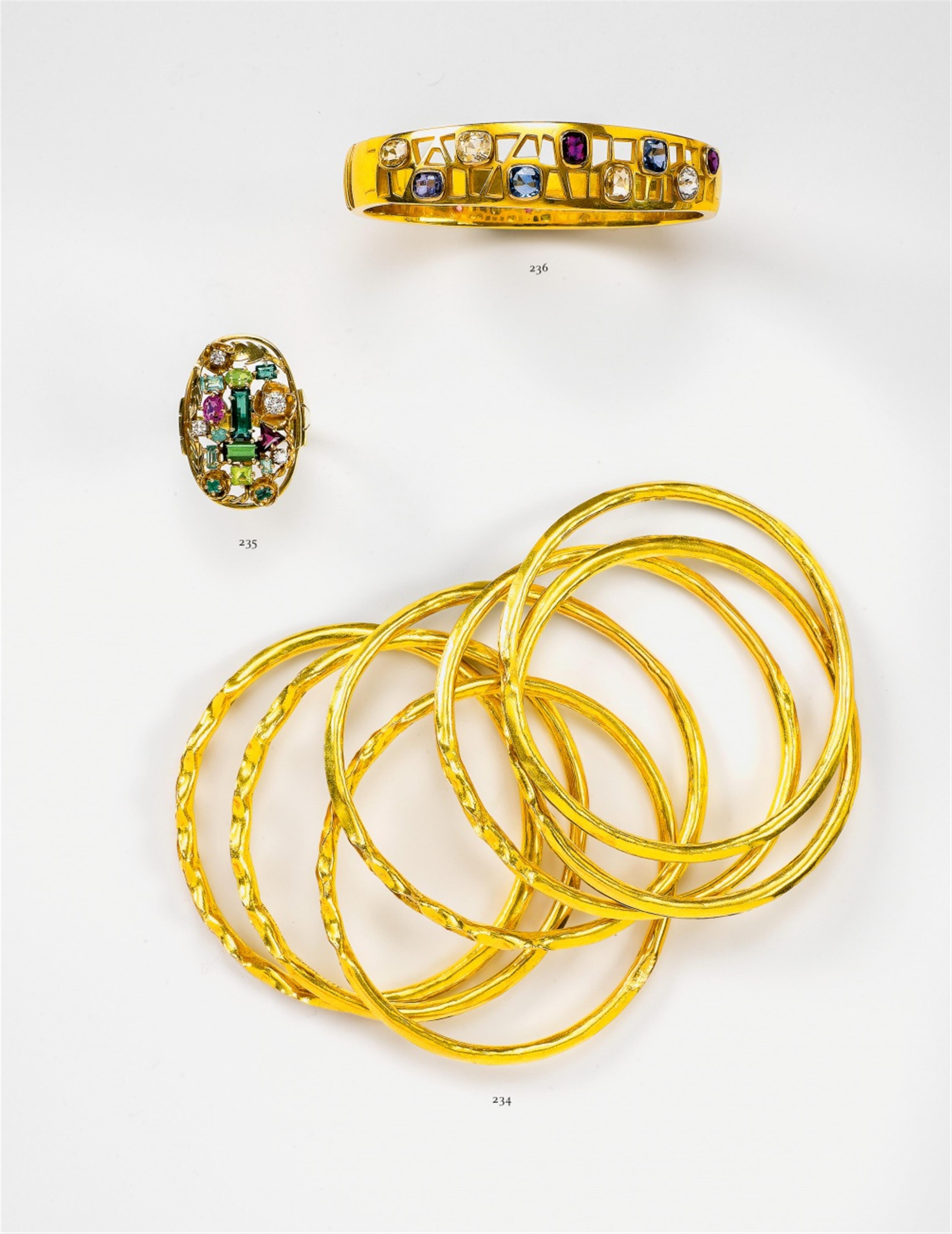 A 14k gold and Ceylon sapphire bangle - image-1