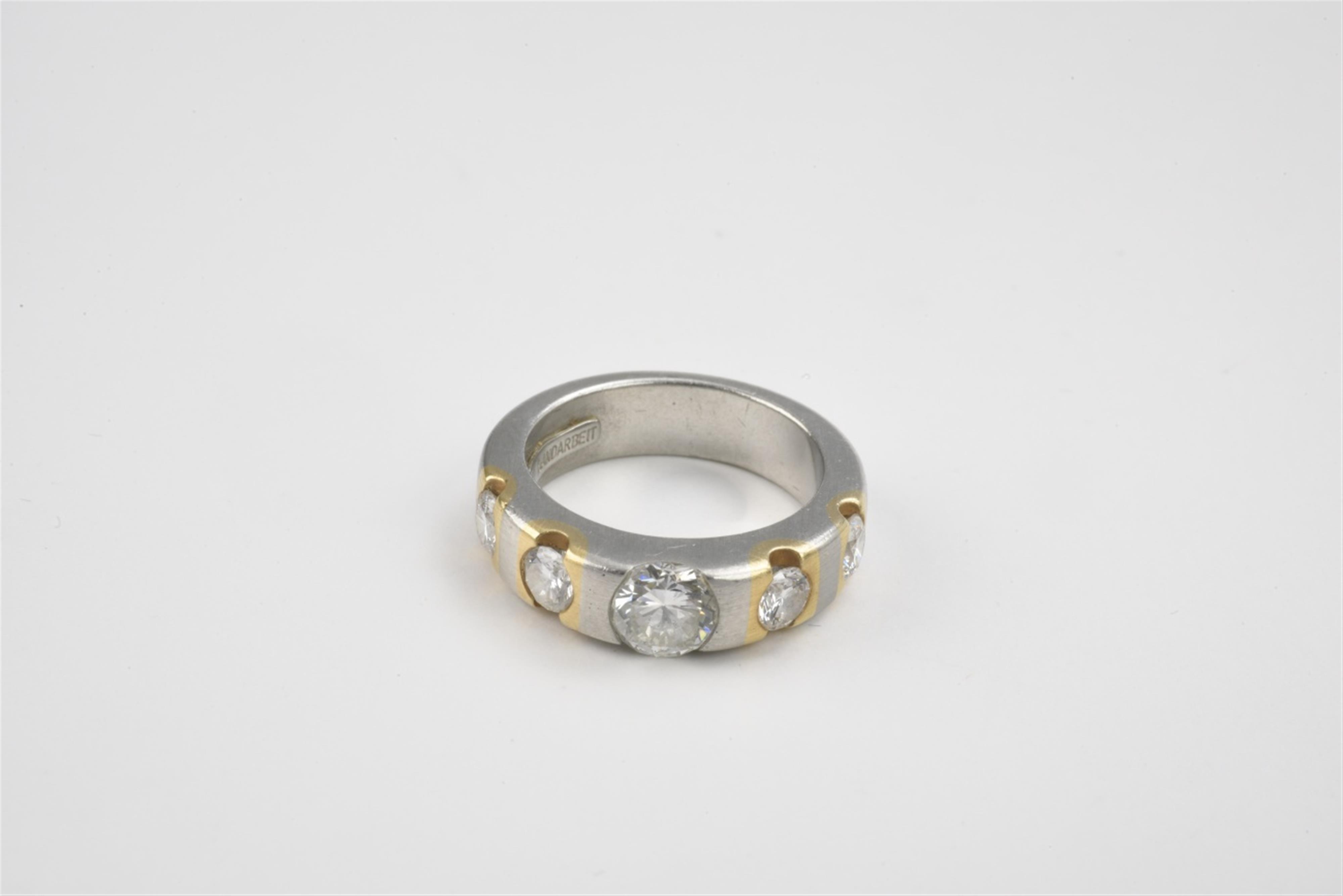A platinum and diamond ring - image-1