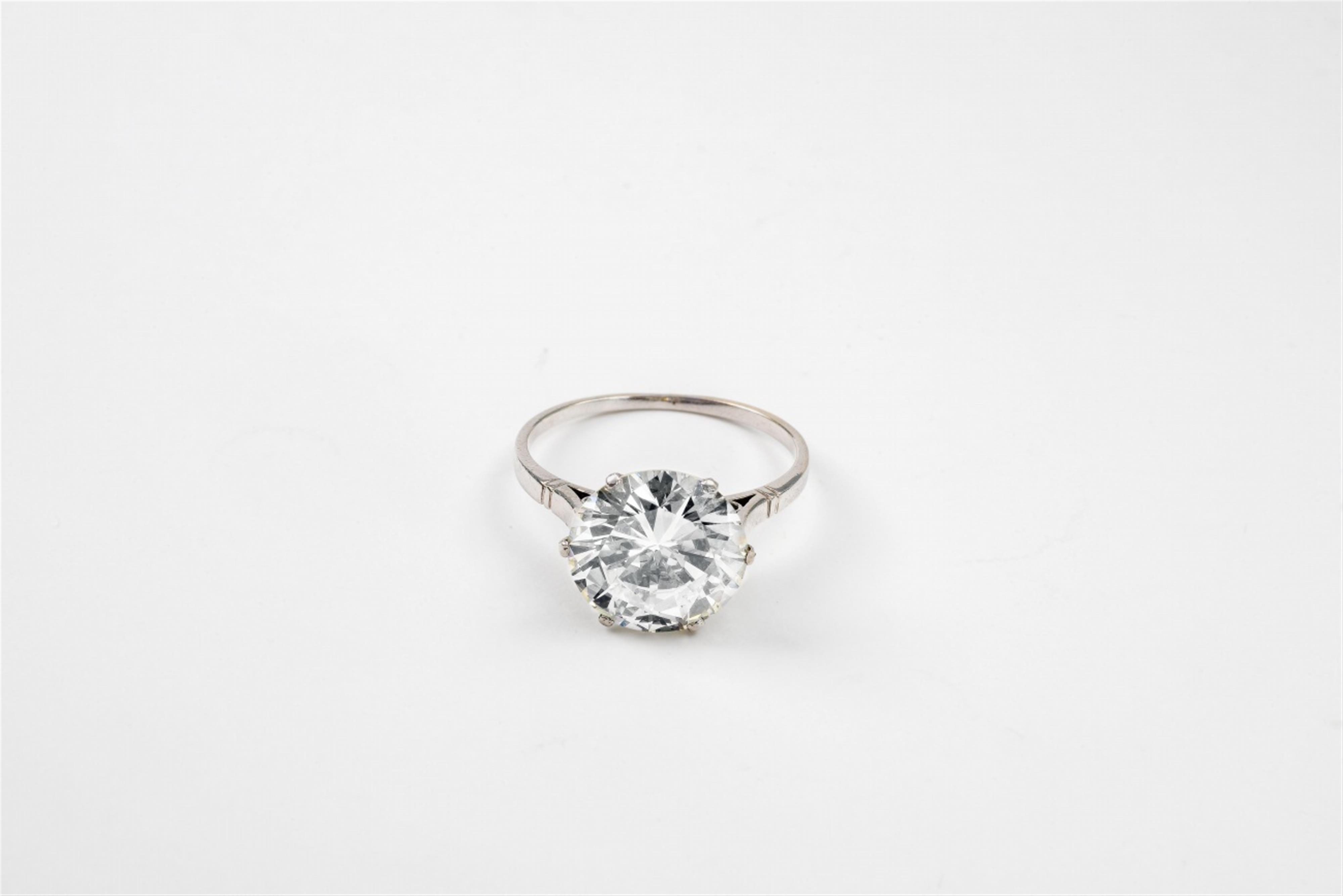 A platinum and diamond solitaire ring - image-1