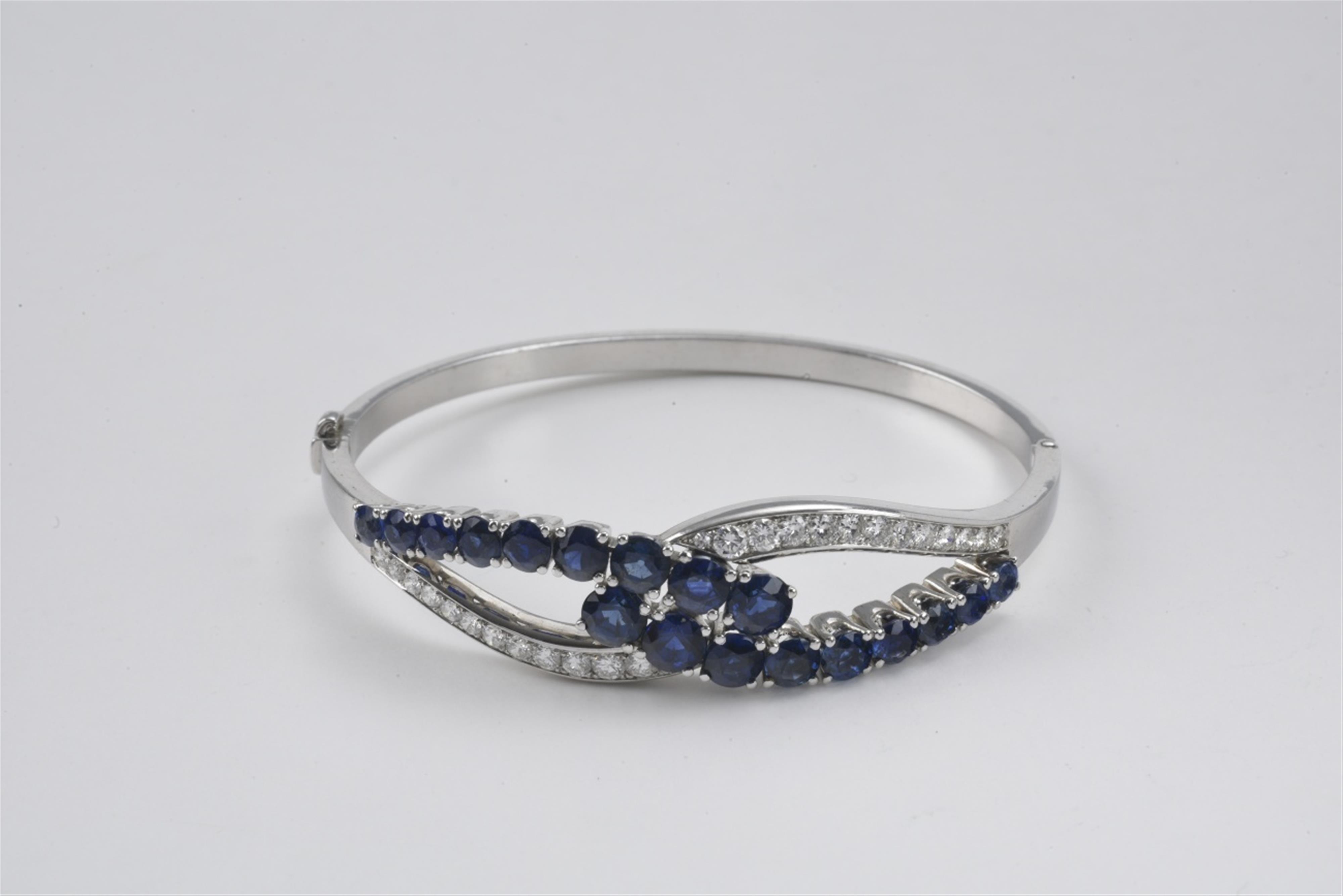 An 18k white gold and sapphire bangle - image-2