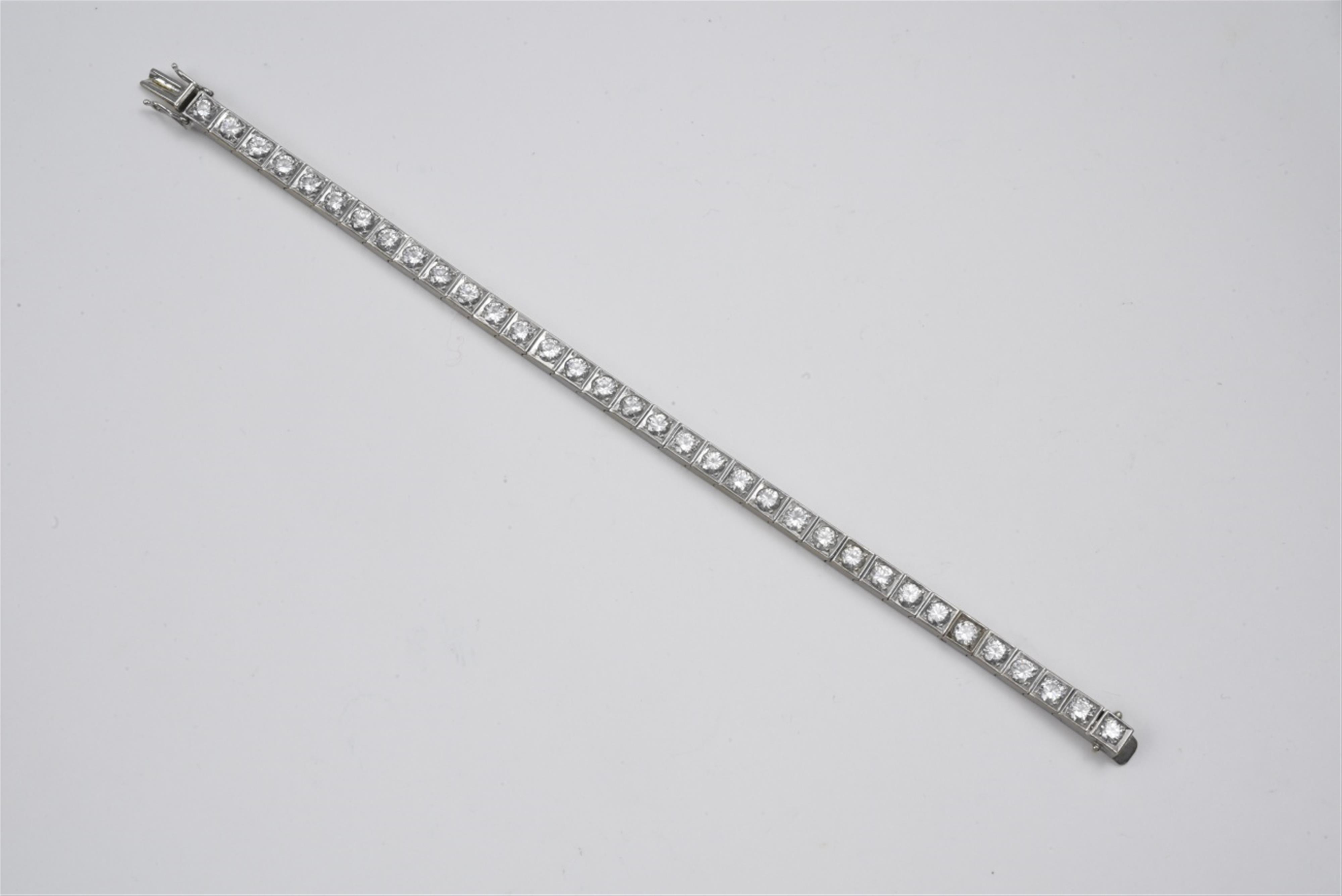A 14k white gold and diamond rivière bracelet - image-1