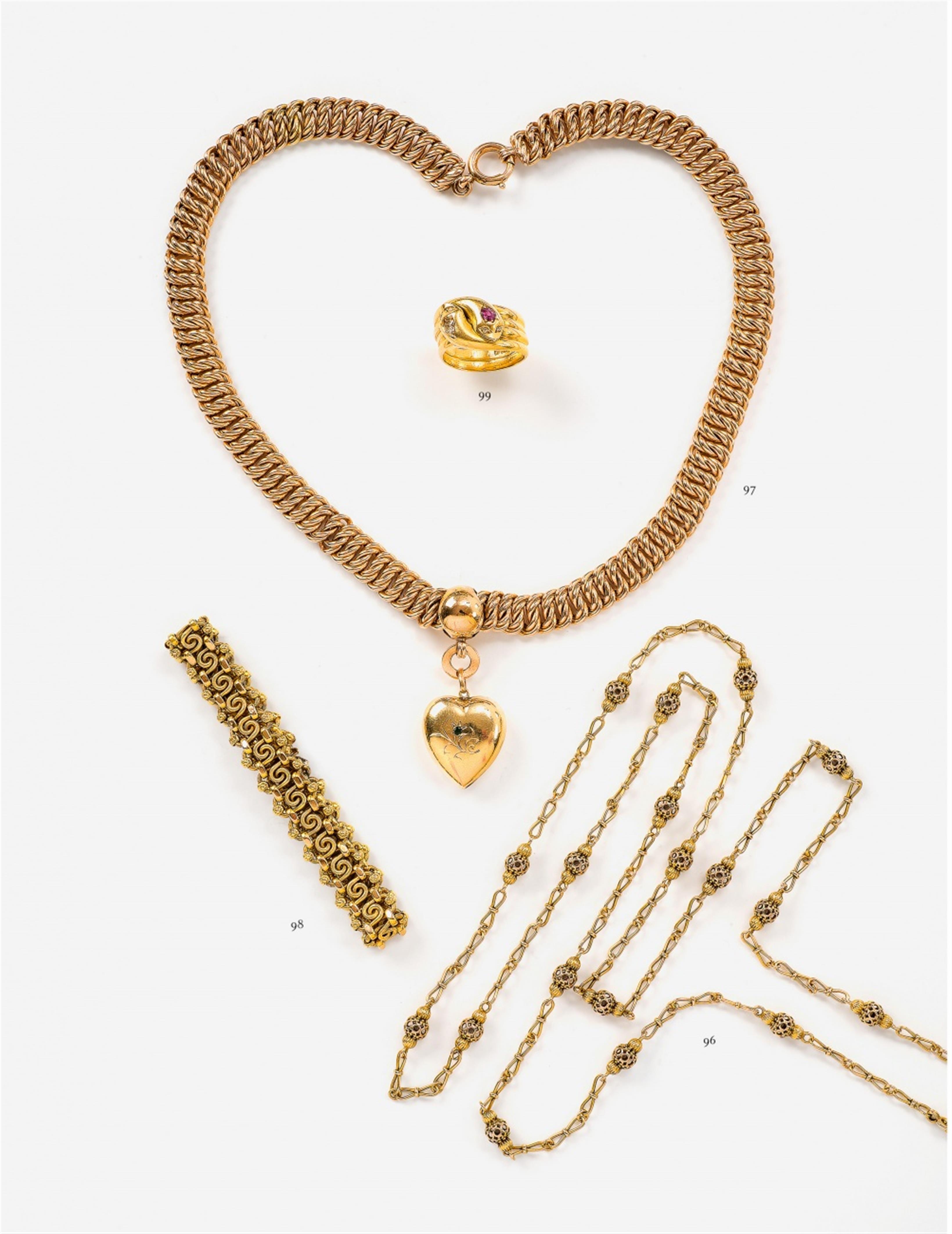 A 14k gold chain with a heart pendant - image-1