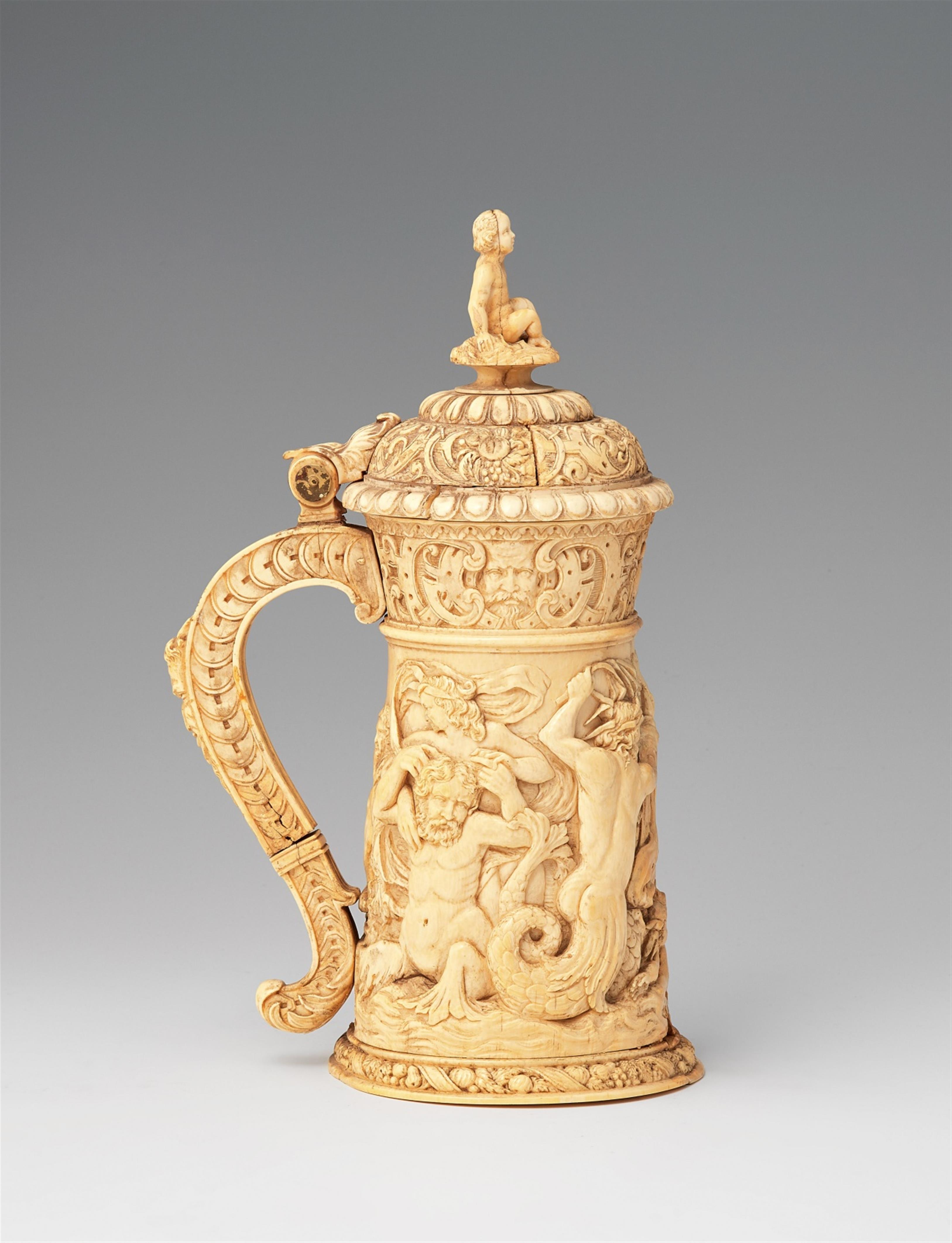 A carved ivory tankard with sea gods - image-1