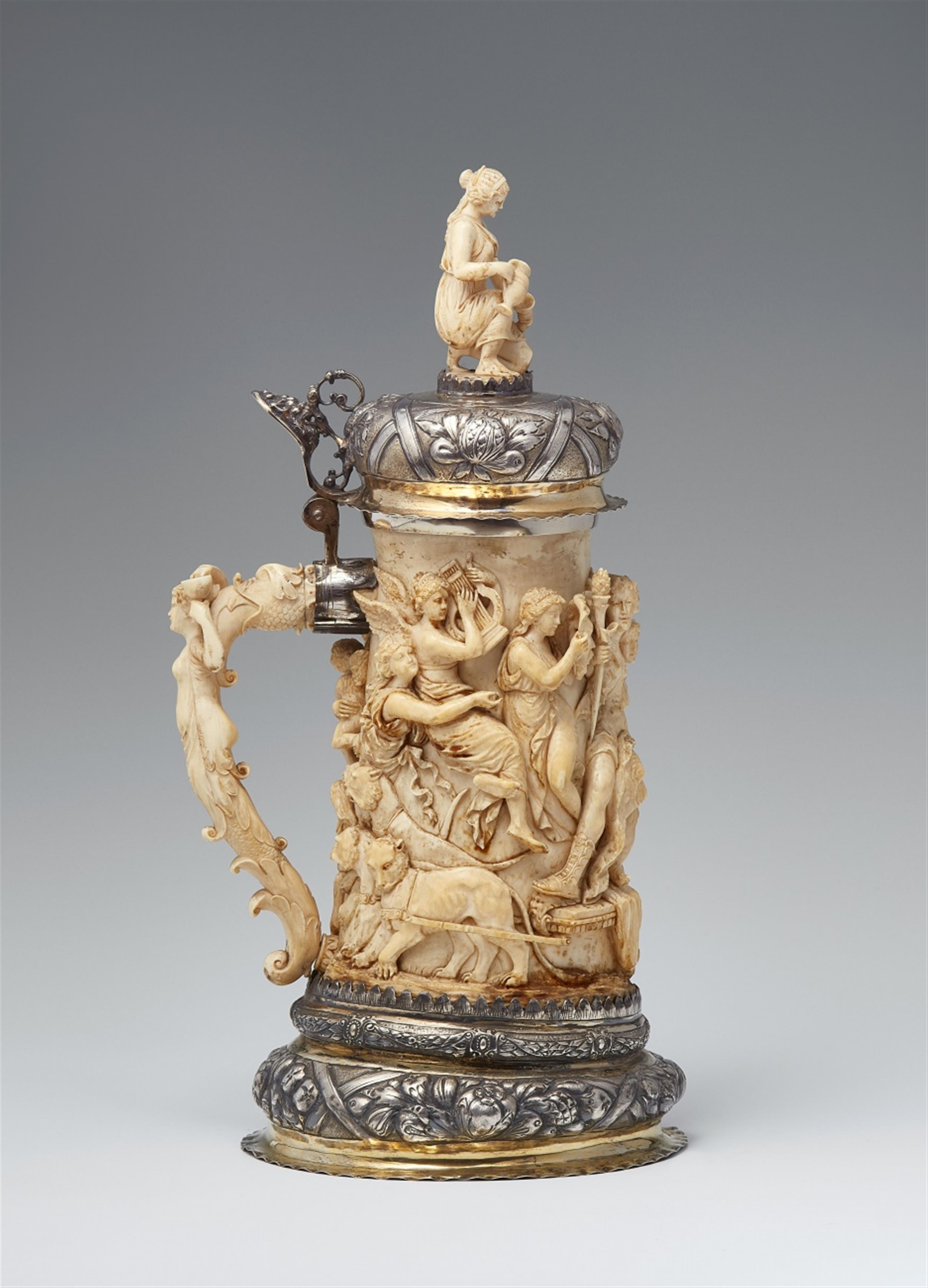 A parcel gilt silver-mounted ivory tankard with the triumph of the gods - image-1