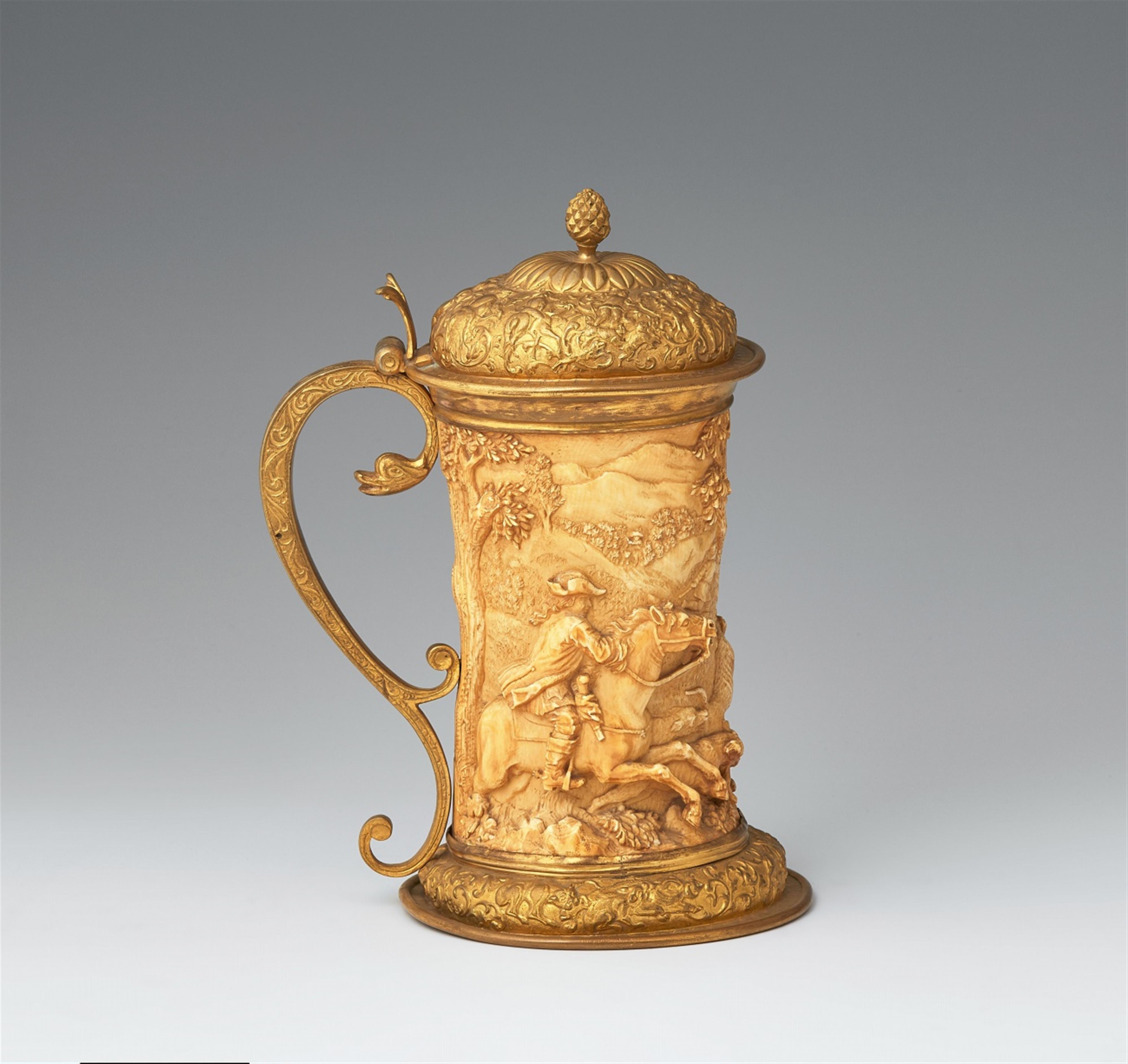 A metal-mounted ivory tankard with a stag hunt - image-2