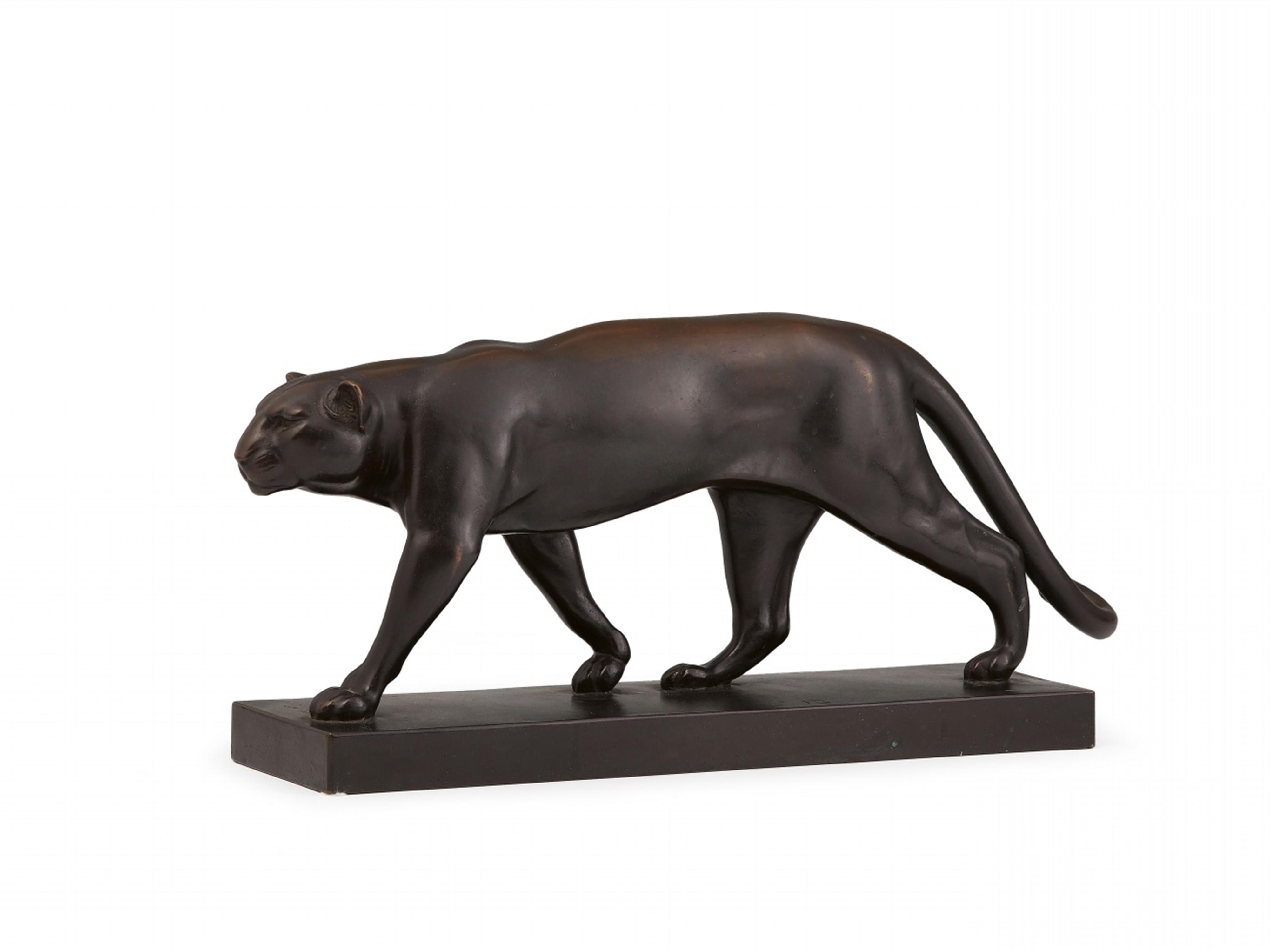 A bronze figure of a leopard  - image-1