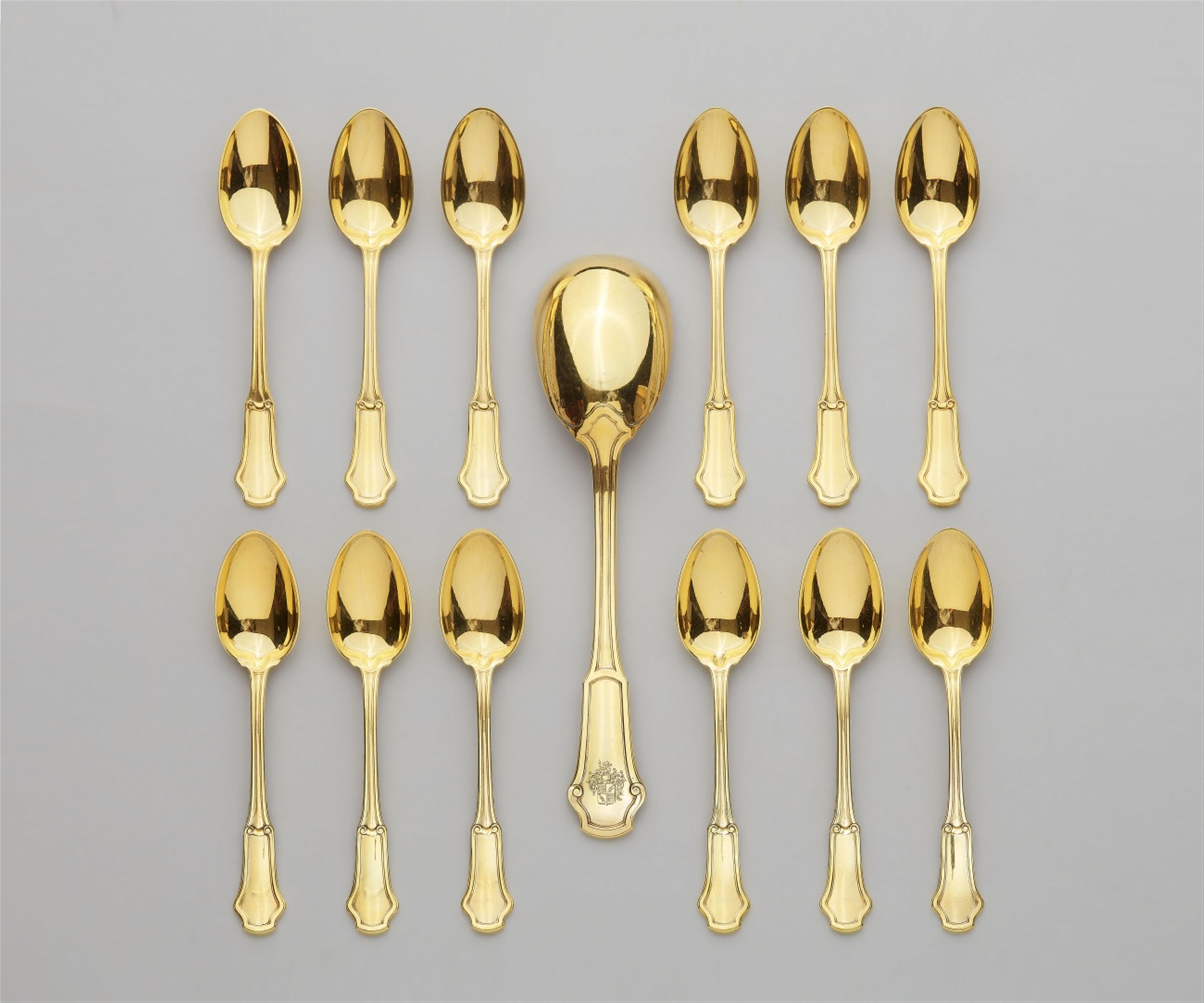 A Parisian silver gilt cream spoon and 12 coffee spoons - image-1