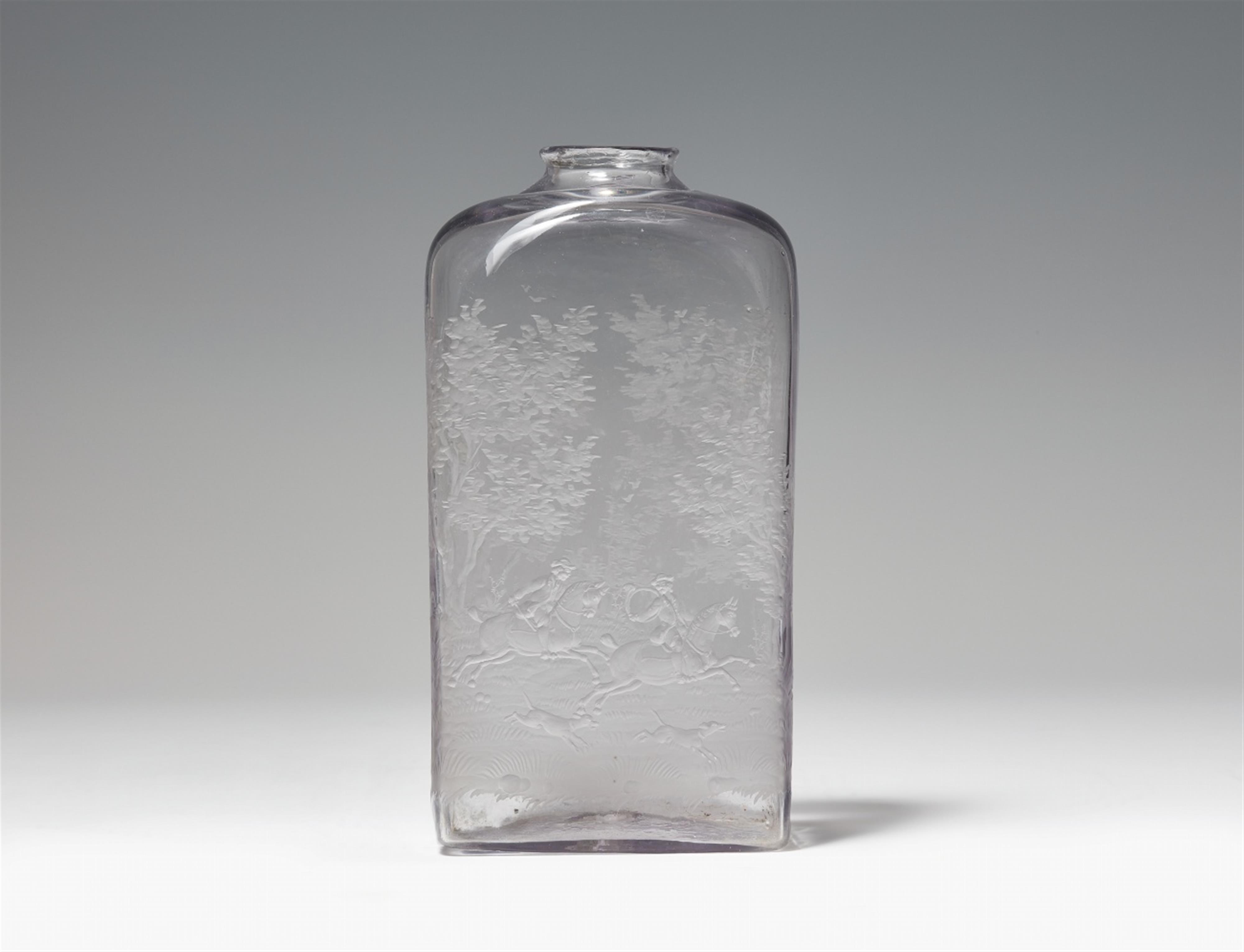 An etched glass bottle with a hunting scene - image-1