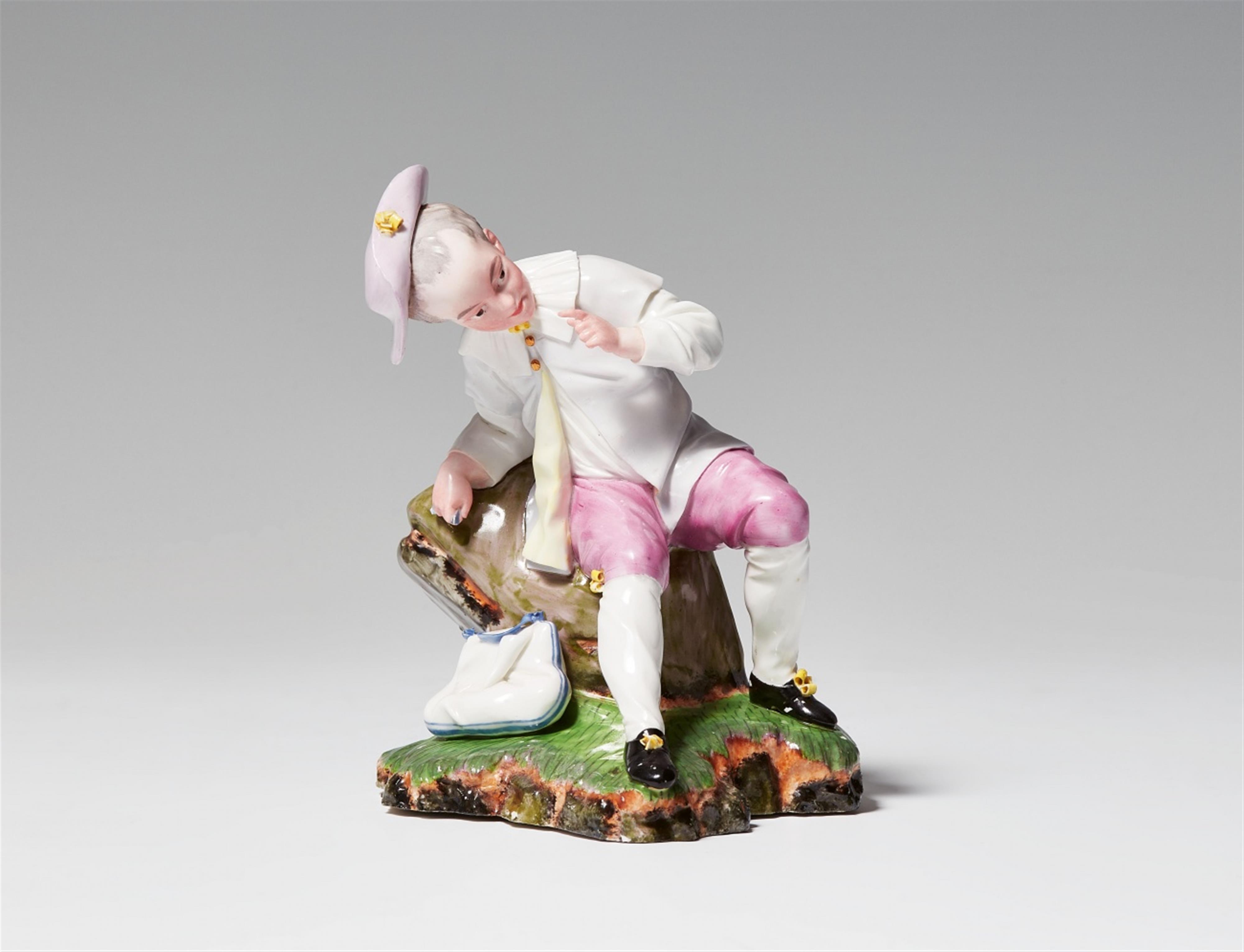 A Höchst porcelain figure of a boy at rest - image-1