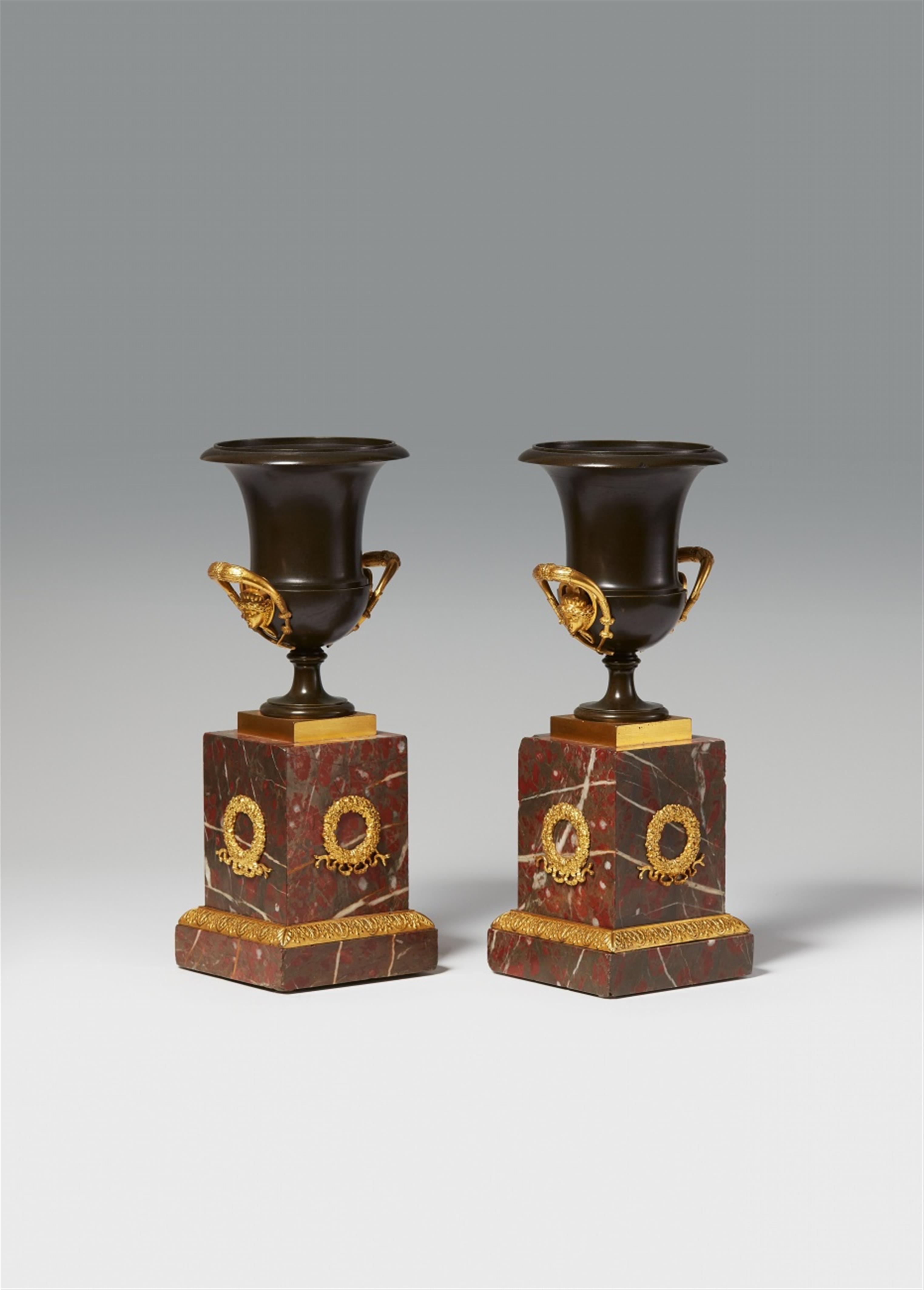 A pair of Empire style ormolu urns - image-1