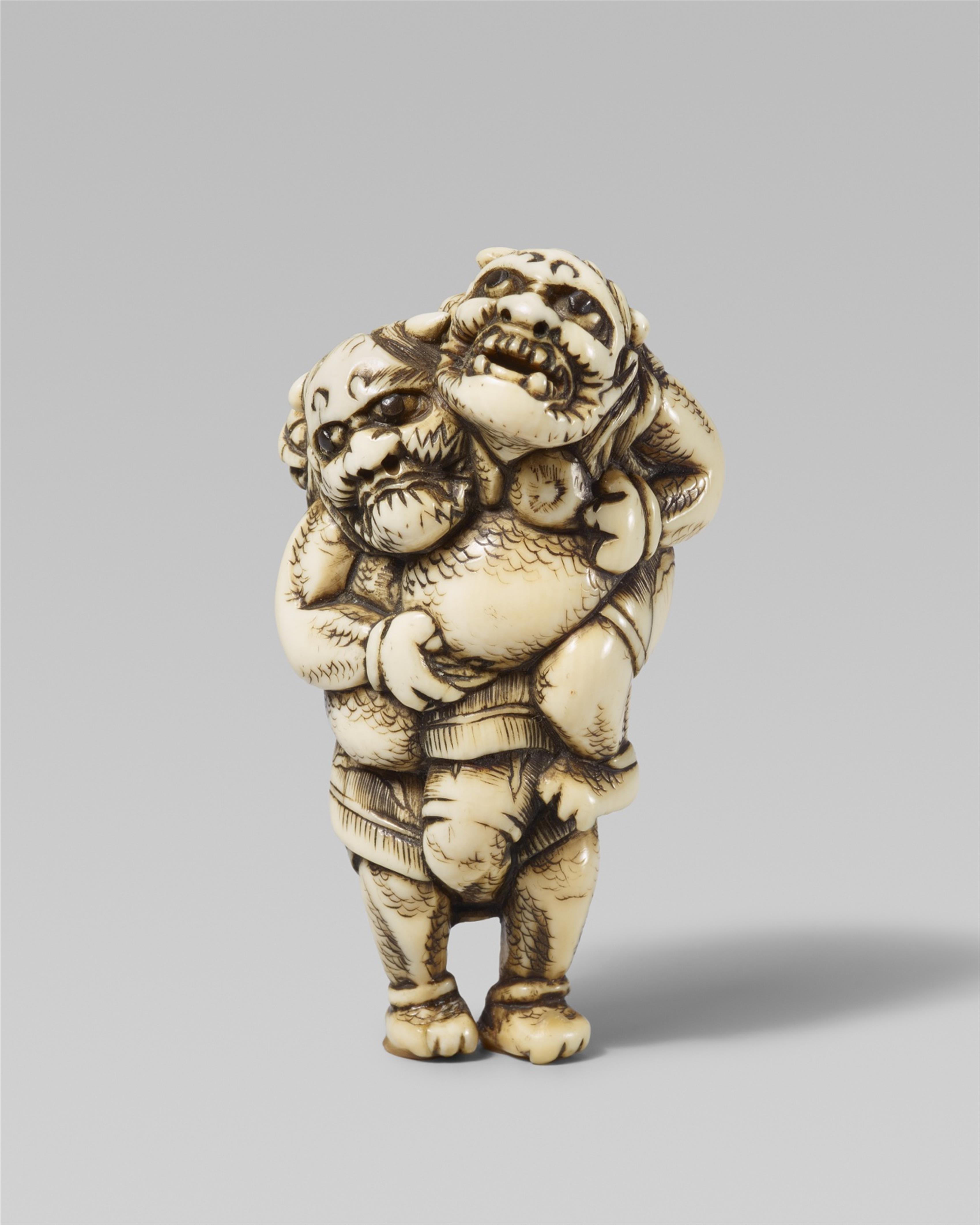 A good and amusing ivory netsuke of two wrestling onis. Early 19th century - image-1