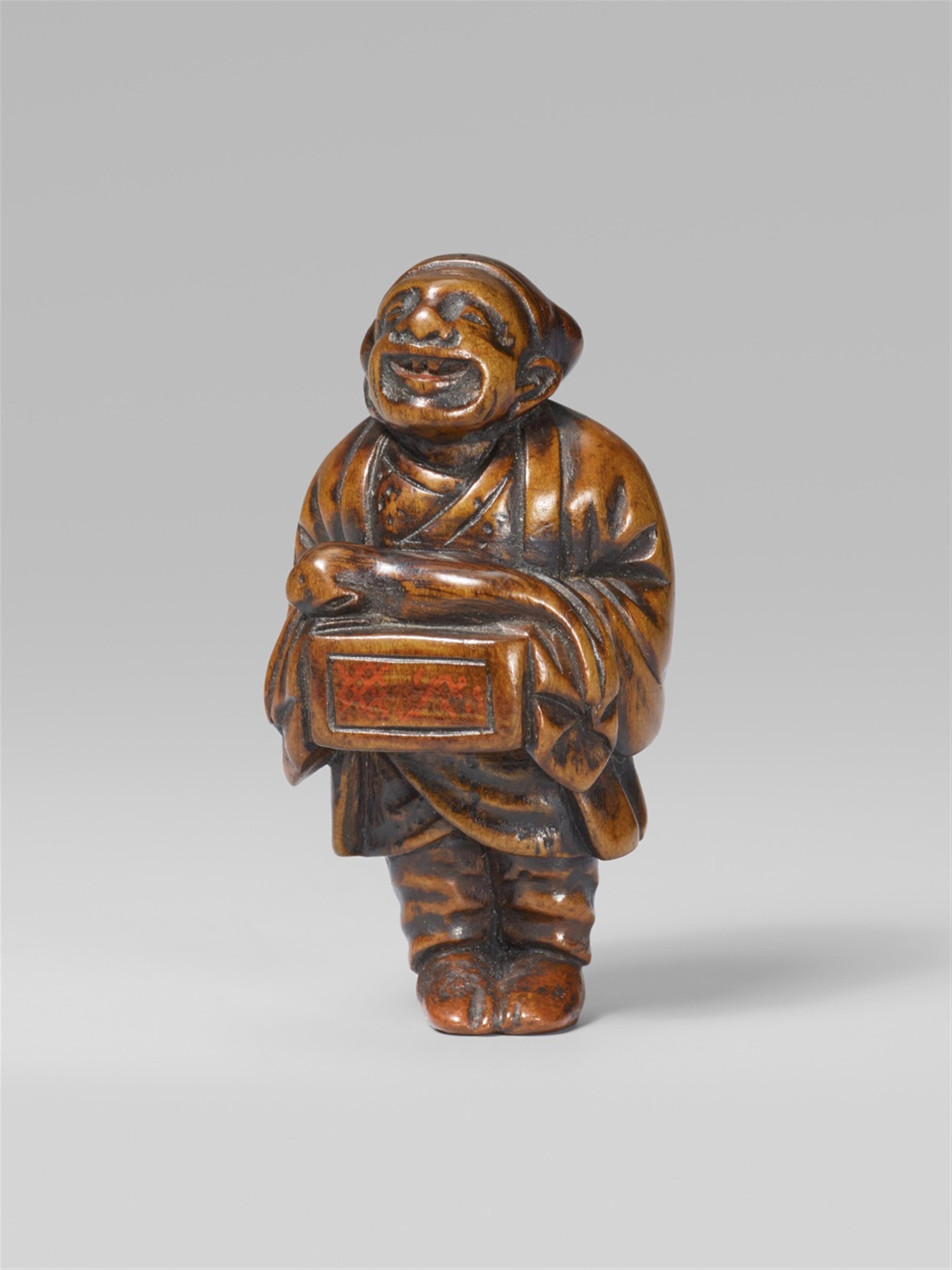 A boxwood netsuke of a street puppeteer. 19th century - image-1