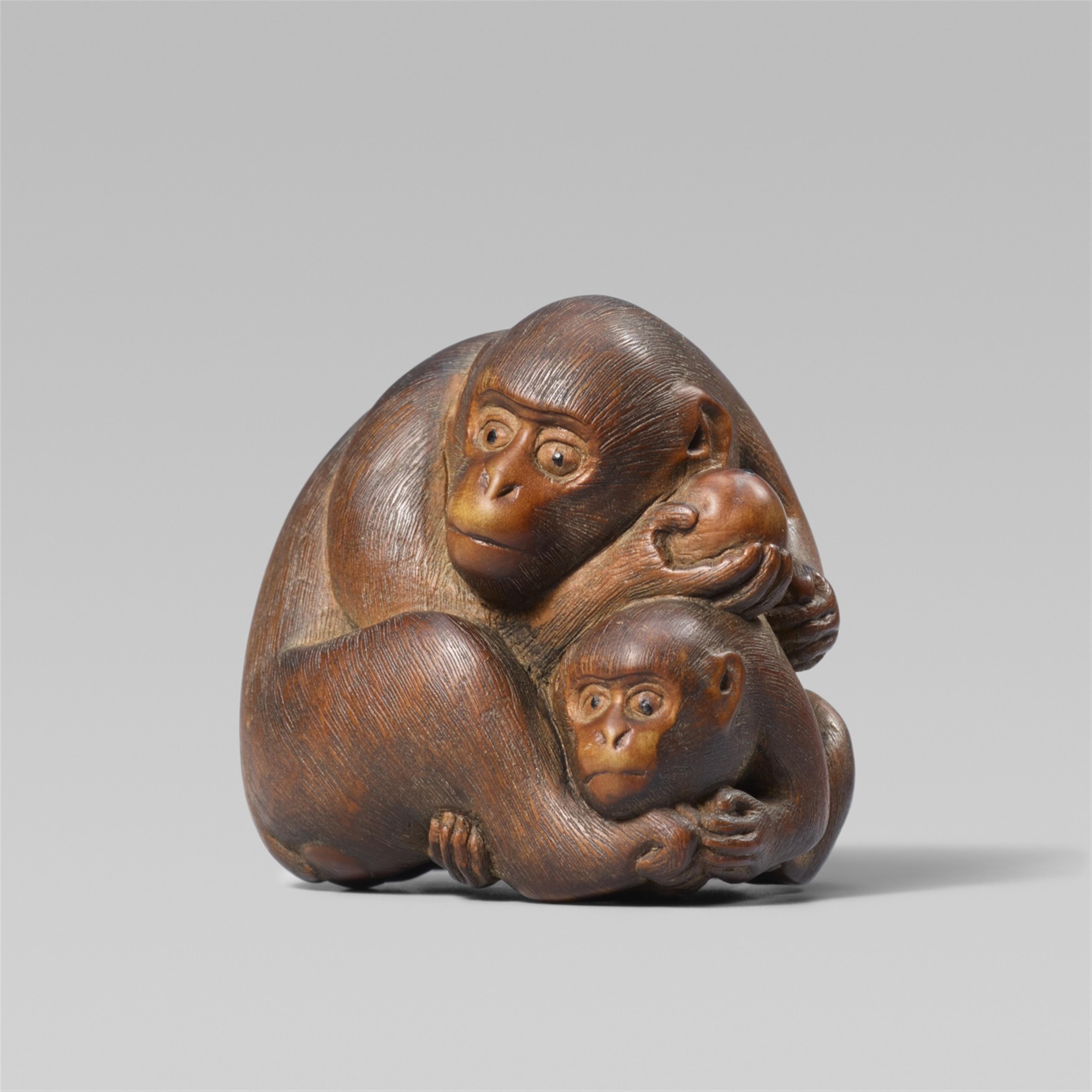 A large okimono-type boxwood netsuke of a monkey and young. Late 19th century - image-1