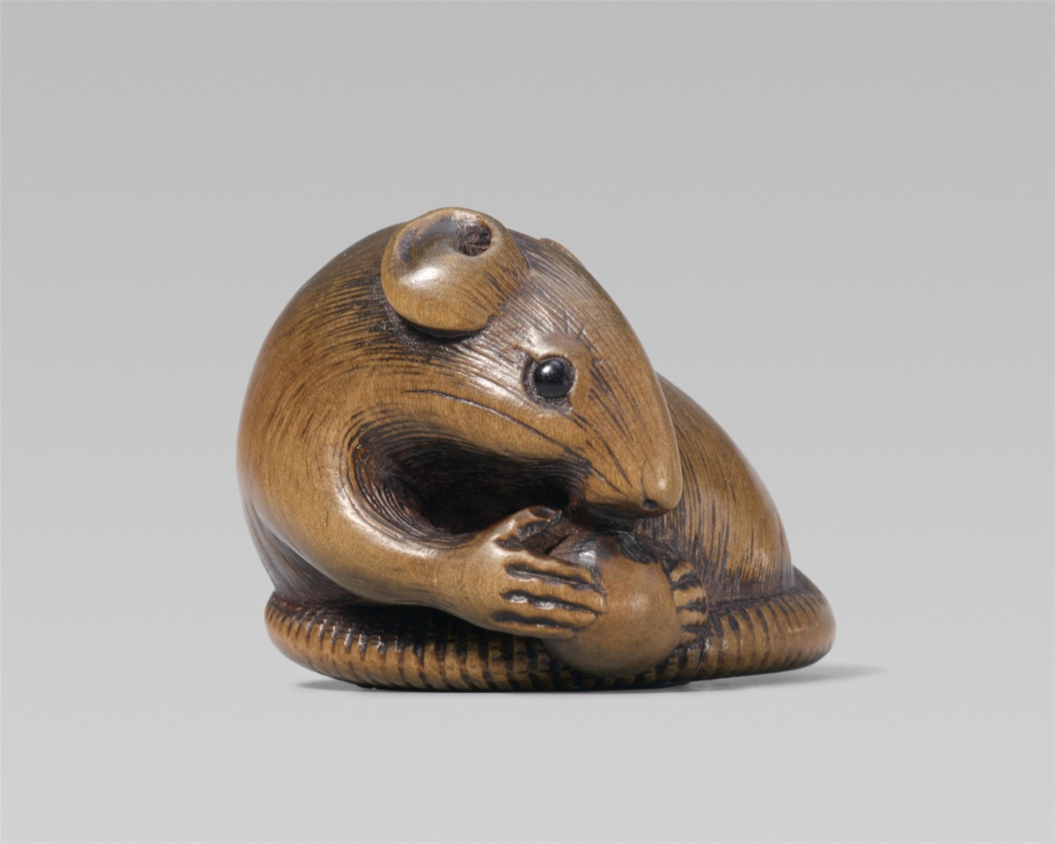 An Ise school boxwood netsuke of a rat with a fruit. Second half 19th century - image-1