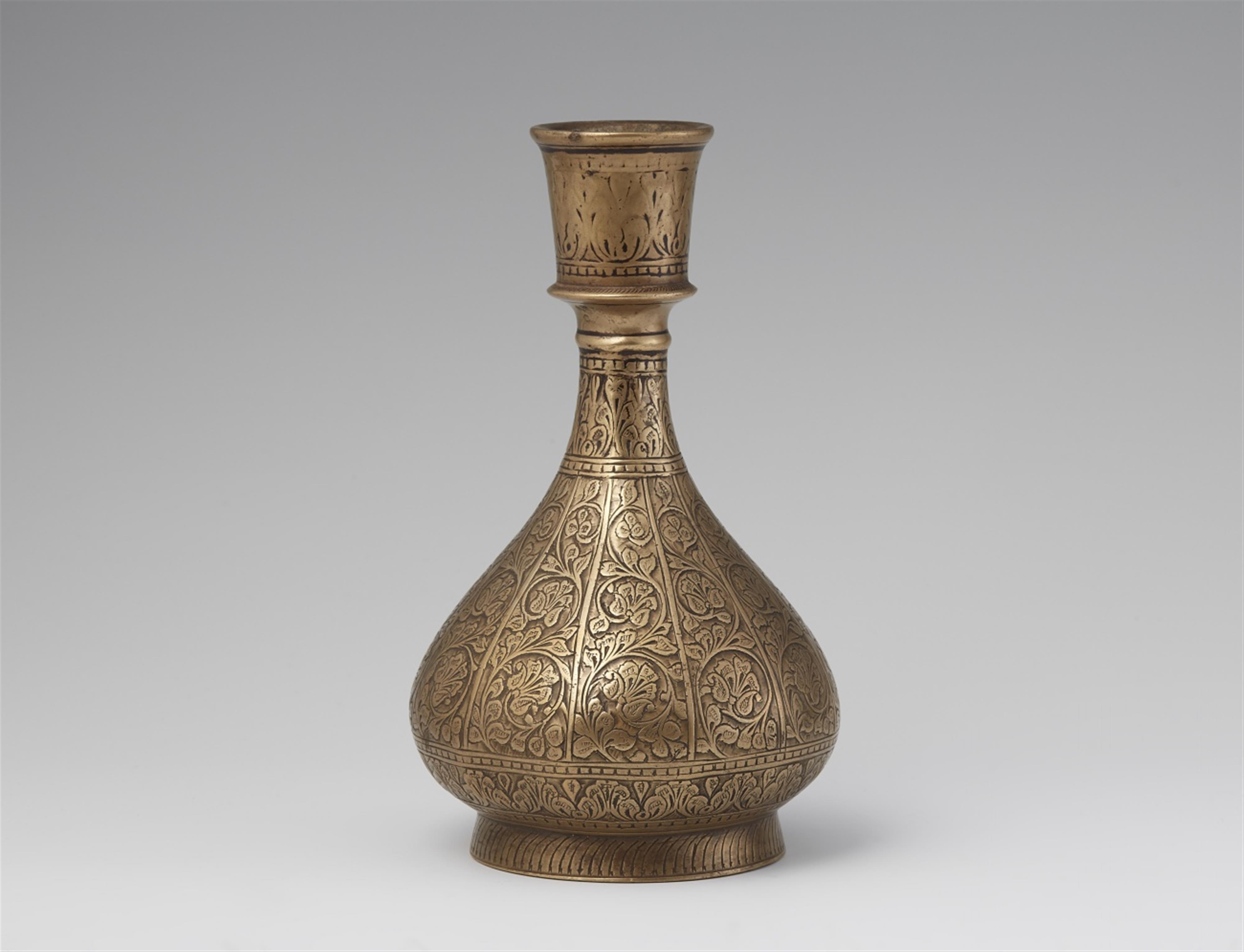 A vase-shaped carved brass huqqua base. Lahore. 17th century - image-1
