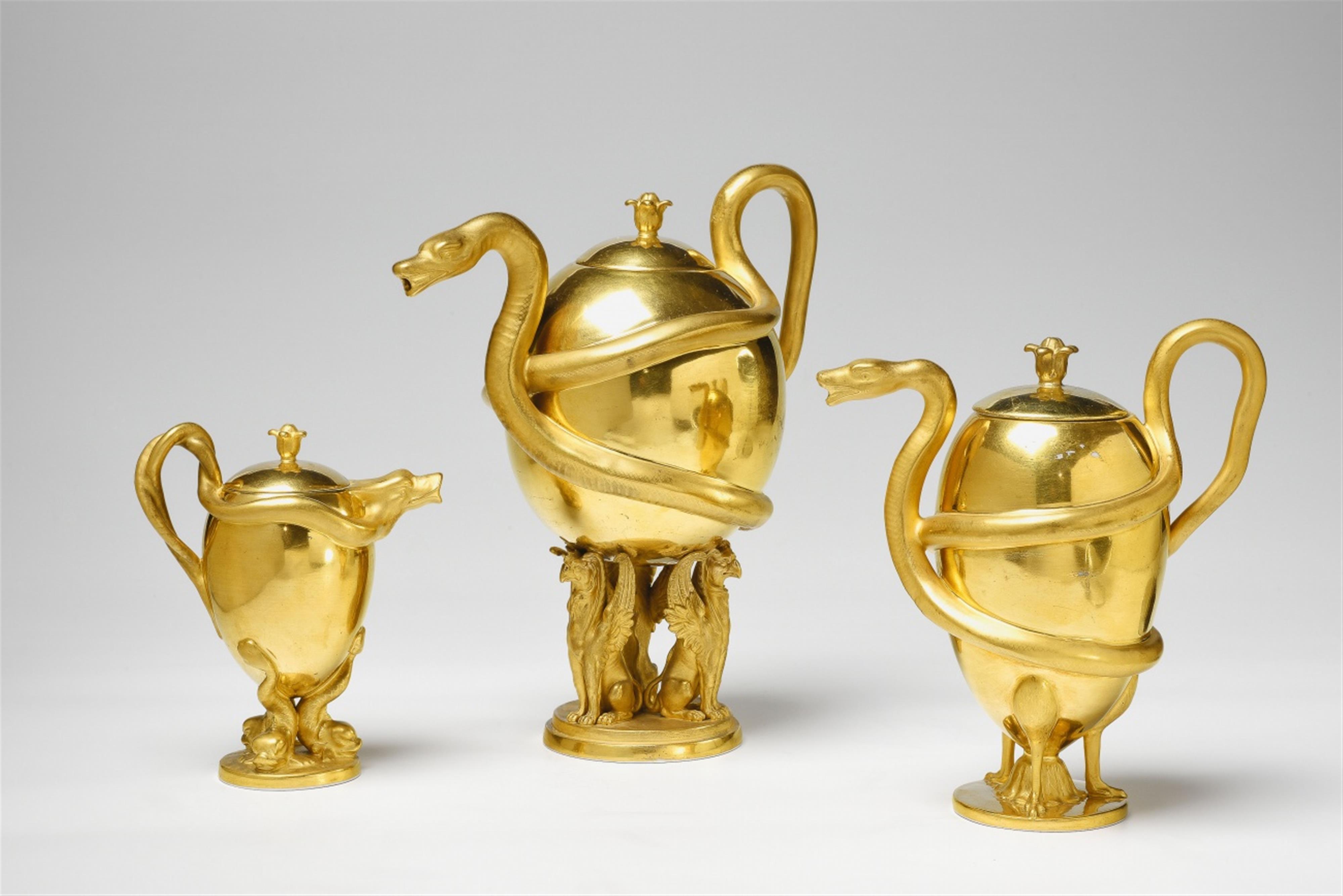 A Berlin KPM porcelain set of three teapots with snake handles - image-2