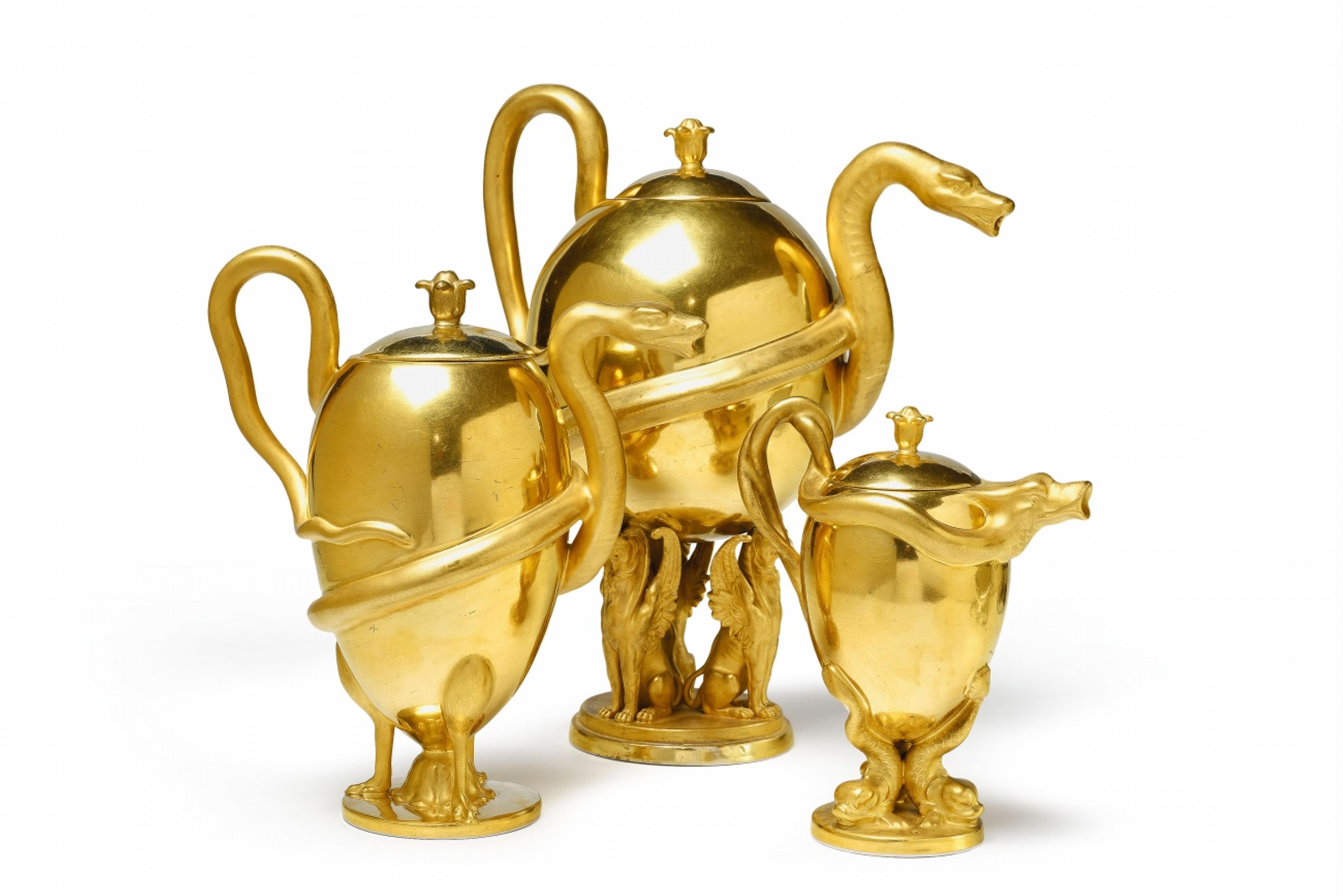 A Berlin KPM porcelain set of three teapots with snake handles - image-1