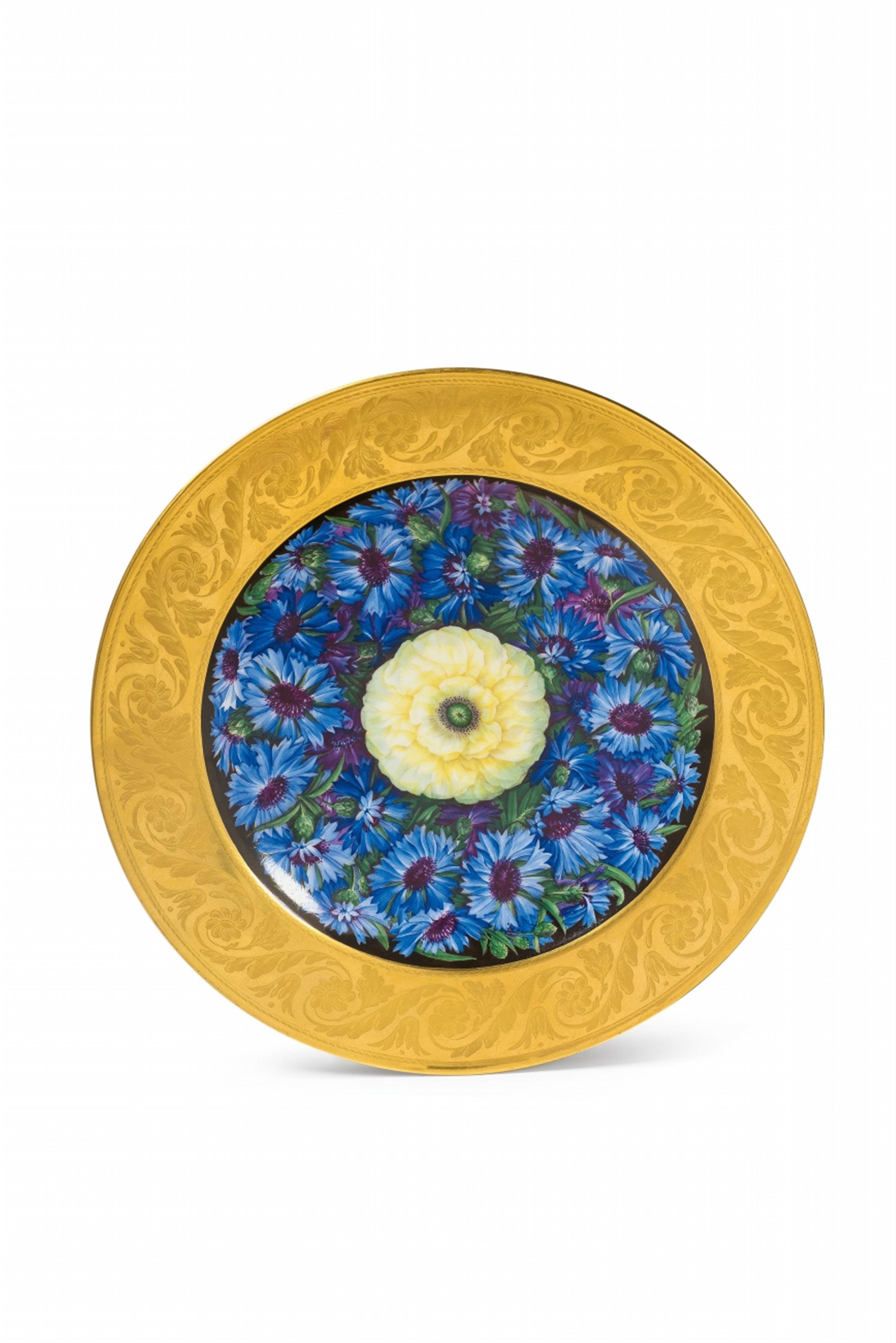 A Berlin KPM porcelain plate with cornflowers and ranunculus - image-1