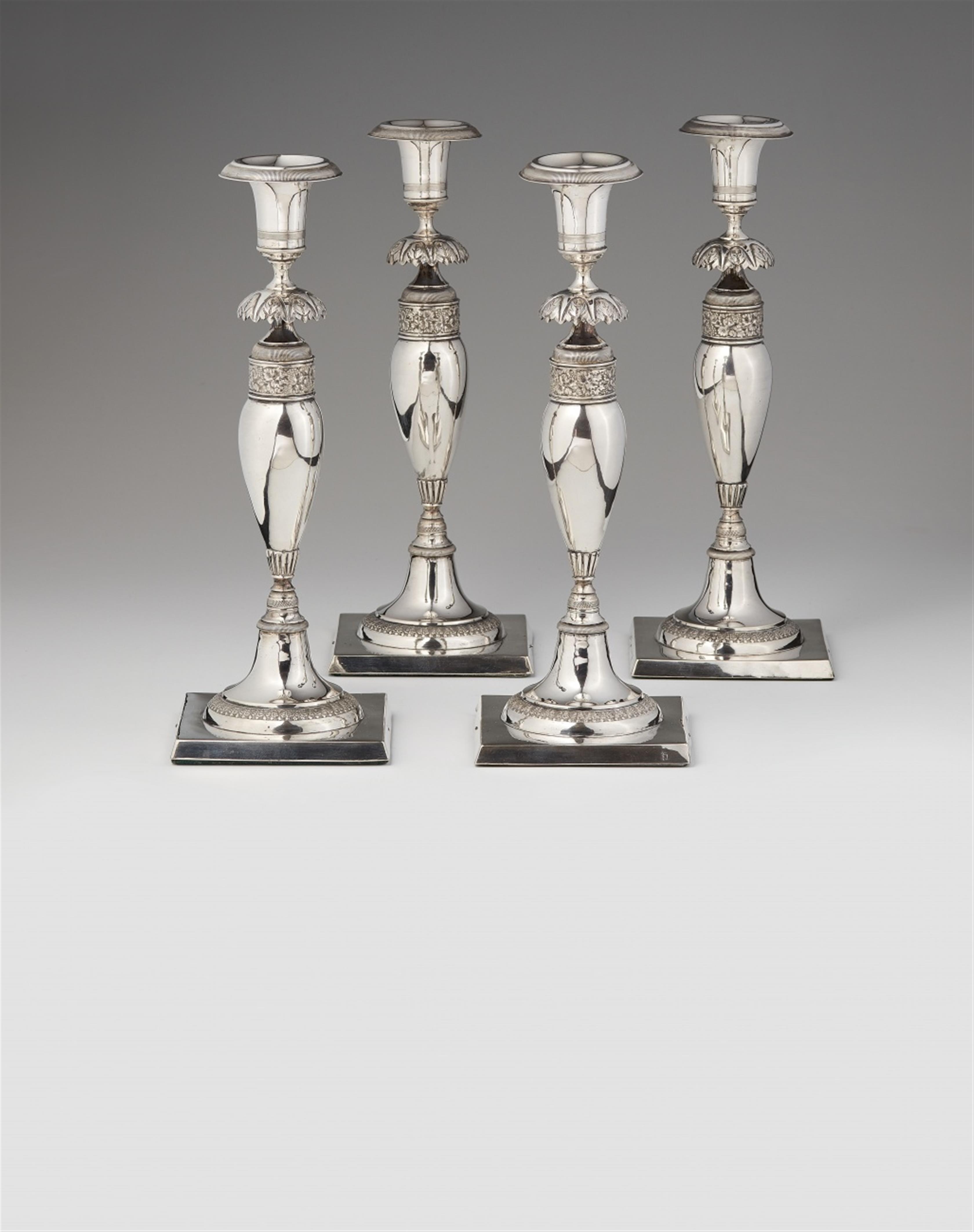 A set of four Berlin silver candlesticks - image-1