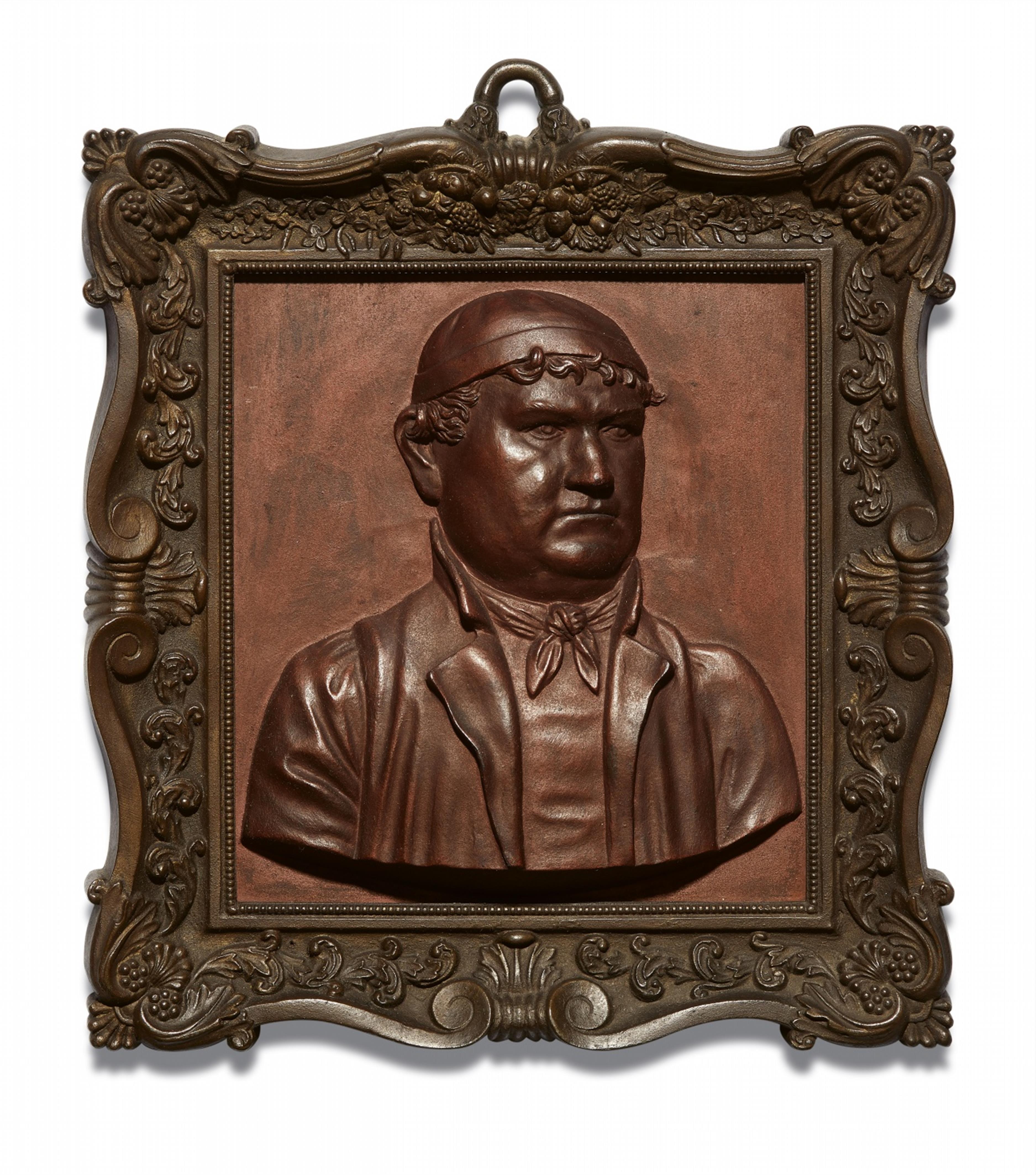 A cast iron plaque with a portrait of a foundryman - image-1