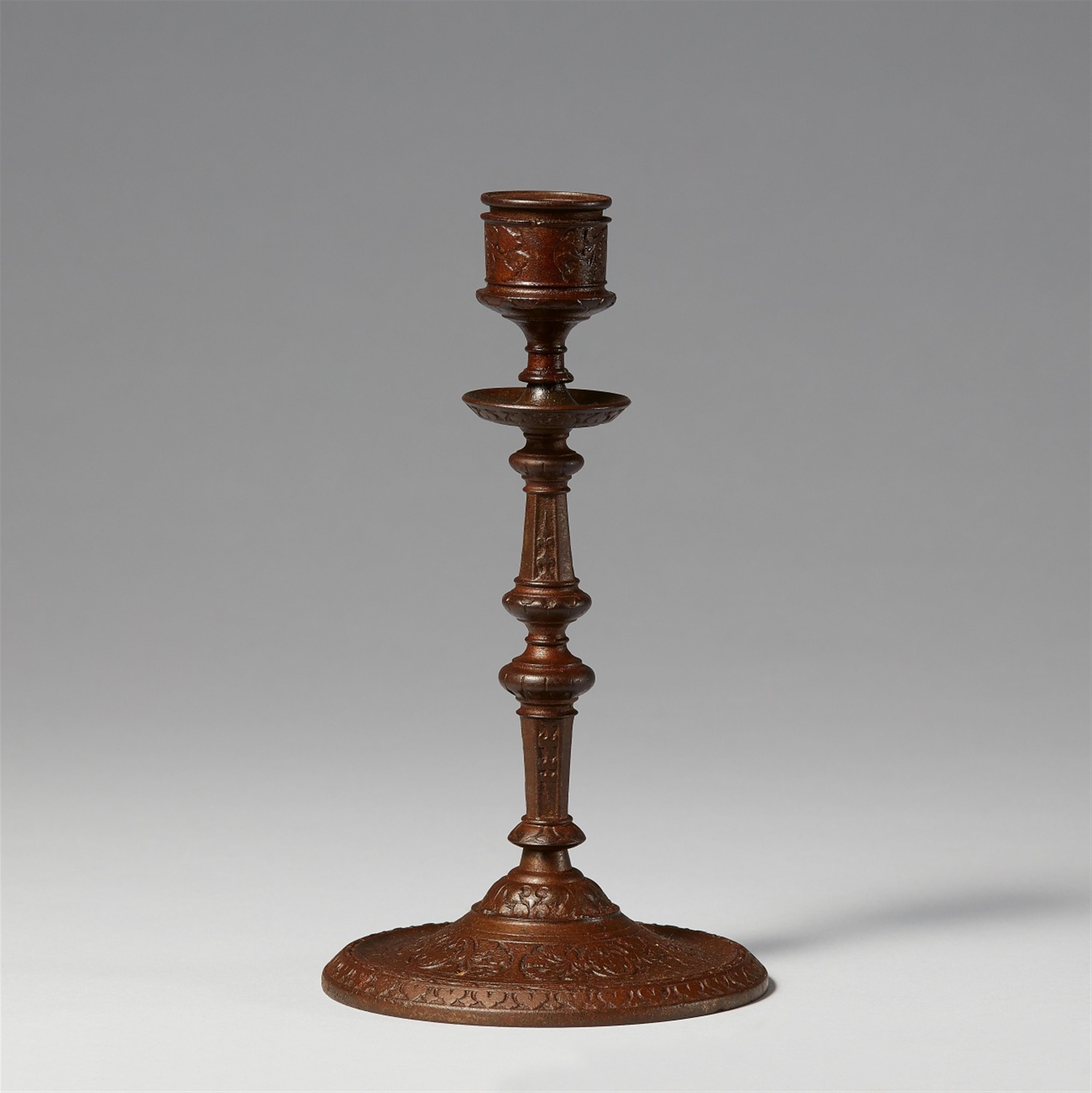 A cast iron grapevine candlestick - image-1