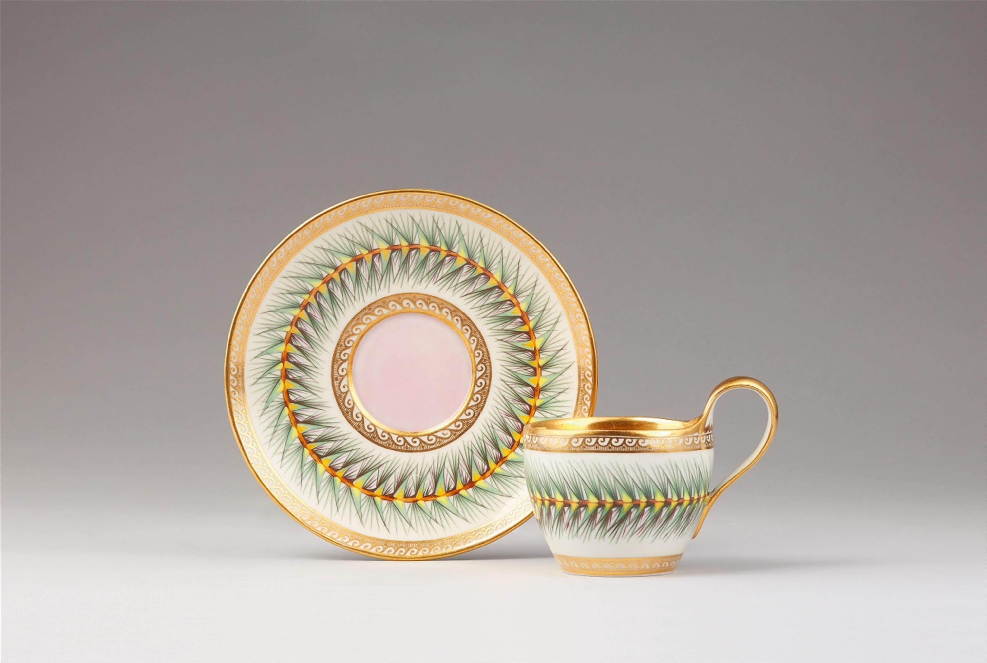 A Berlin KPM porcelain cup and saucer with pine branches - image-1