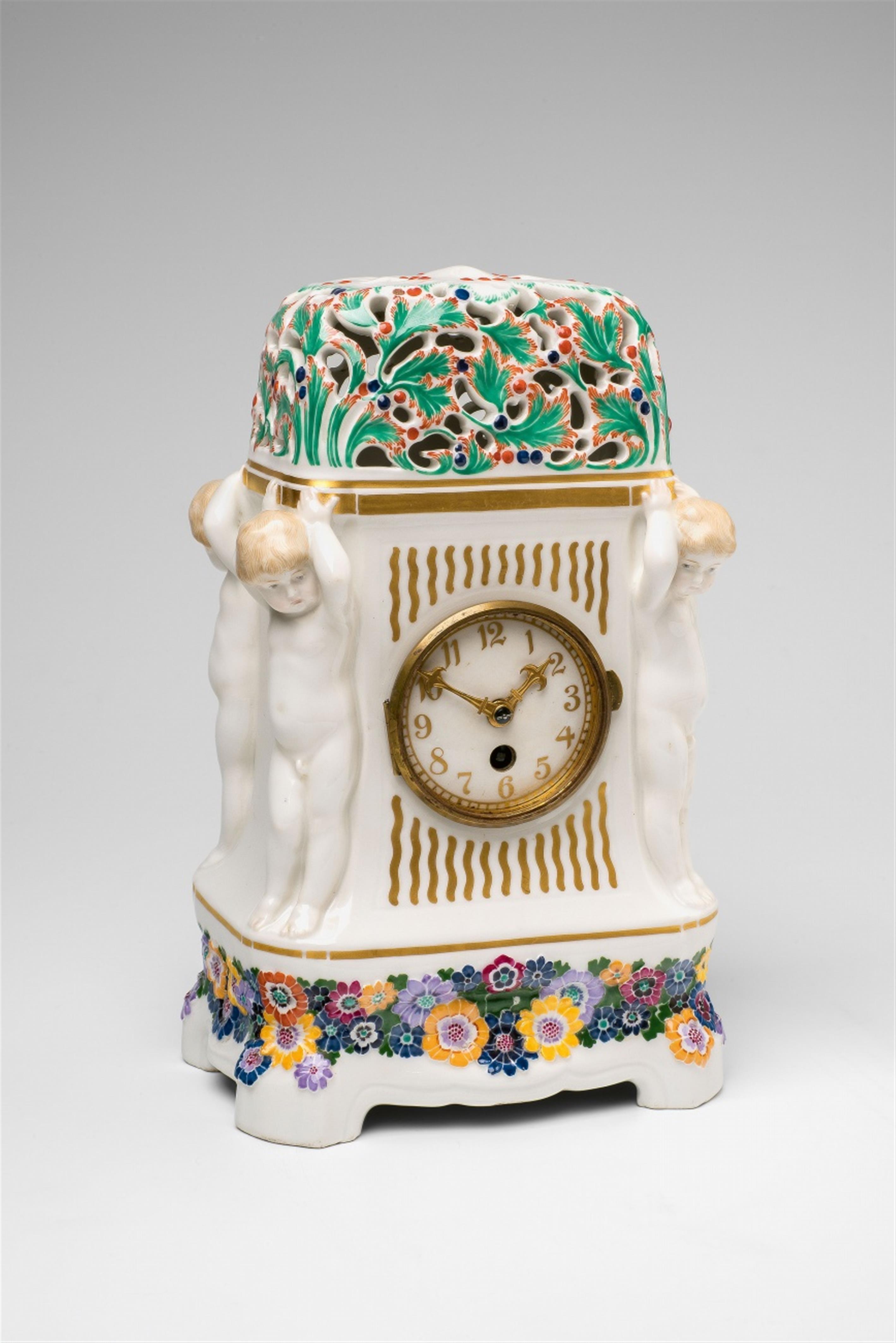 A Berlin KPM Jugendstil porcelain mantle clock with putti - image-1