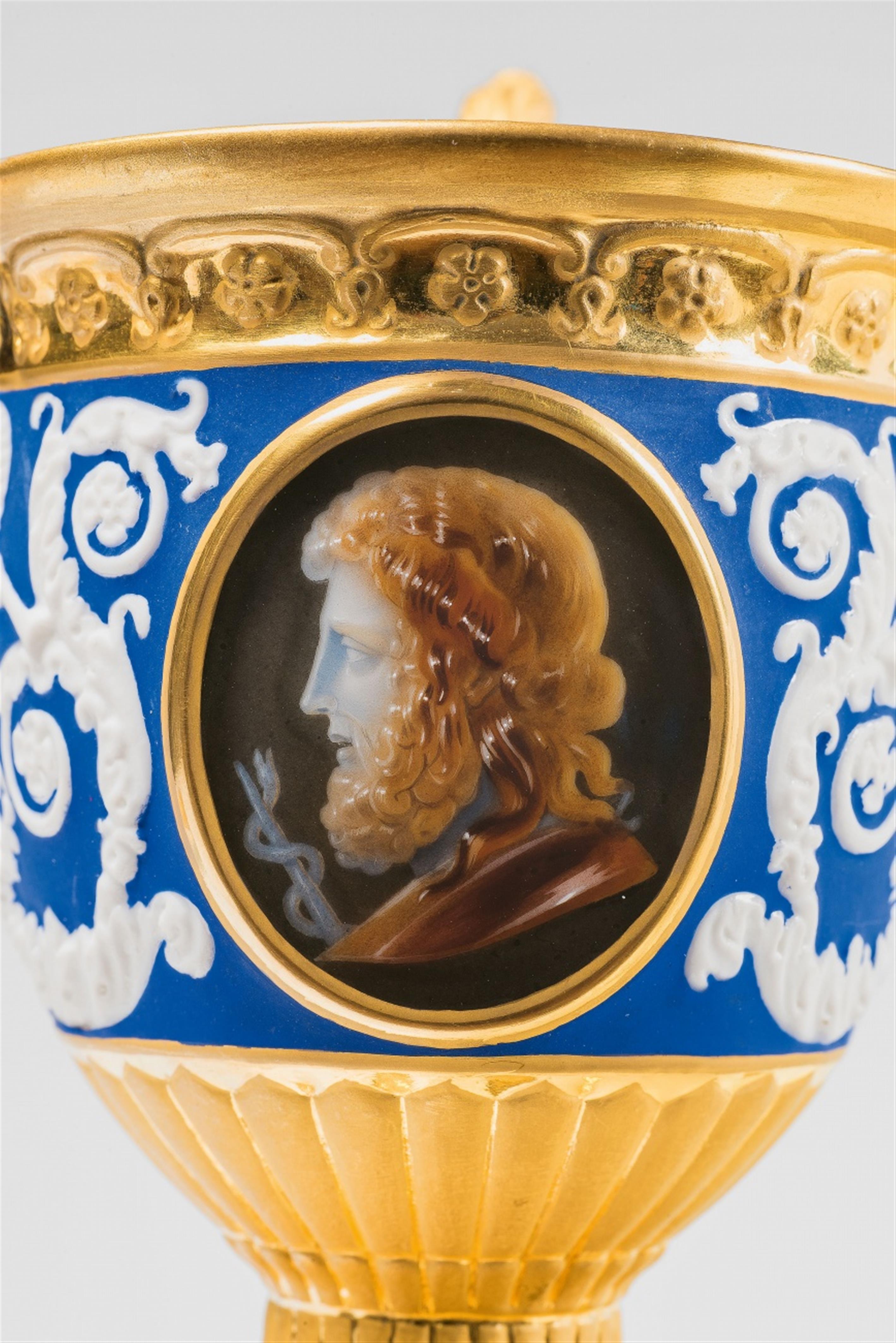 A Berlin KPM porcelain cup with grotesques in relief and cameo painting - image-2