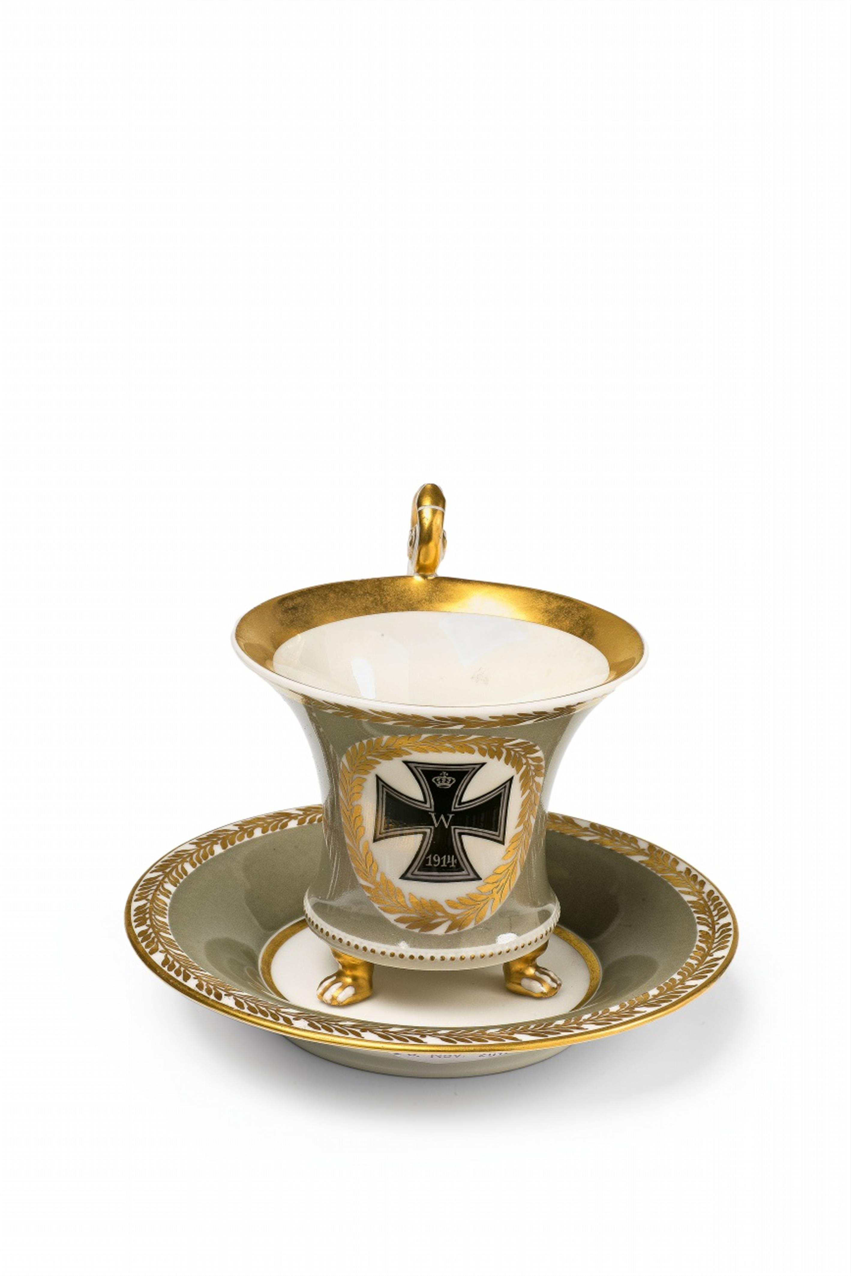 A Berlin KPM porcelain cup and saucer with the Iron Cross - image-1
