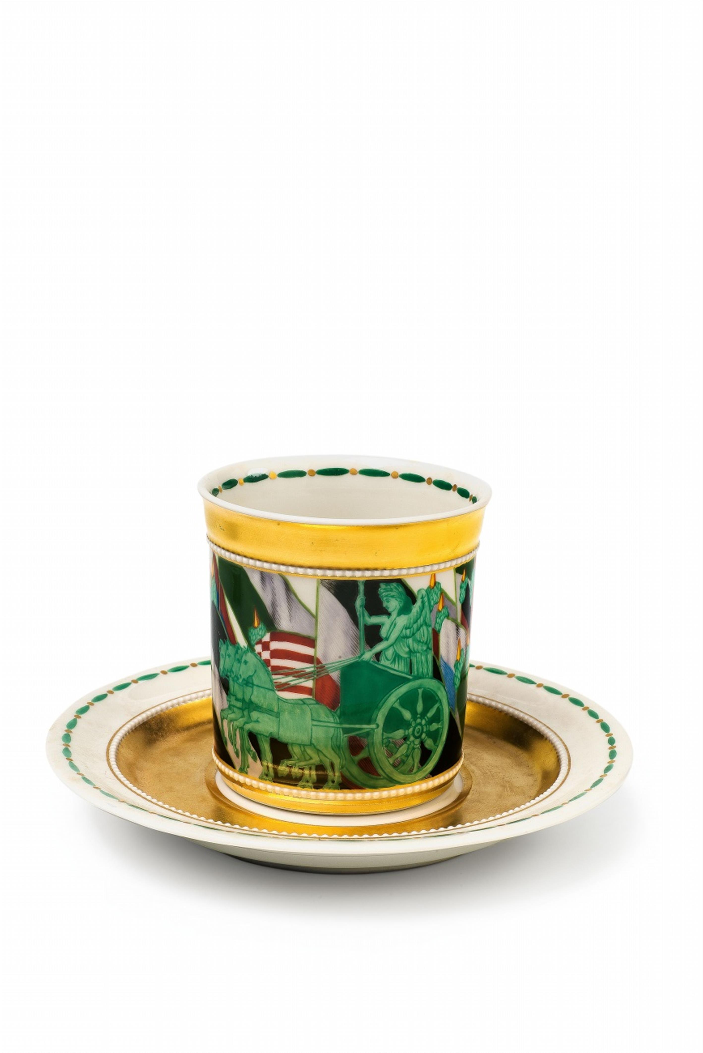 A Berlin KPM porcelain cup and saucer with a figure of Victory before the flags of the German Empire - image-1