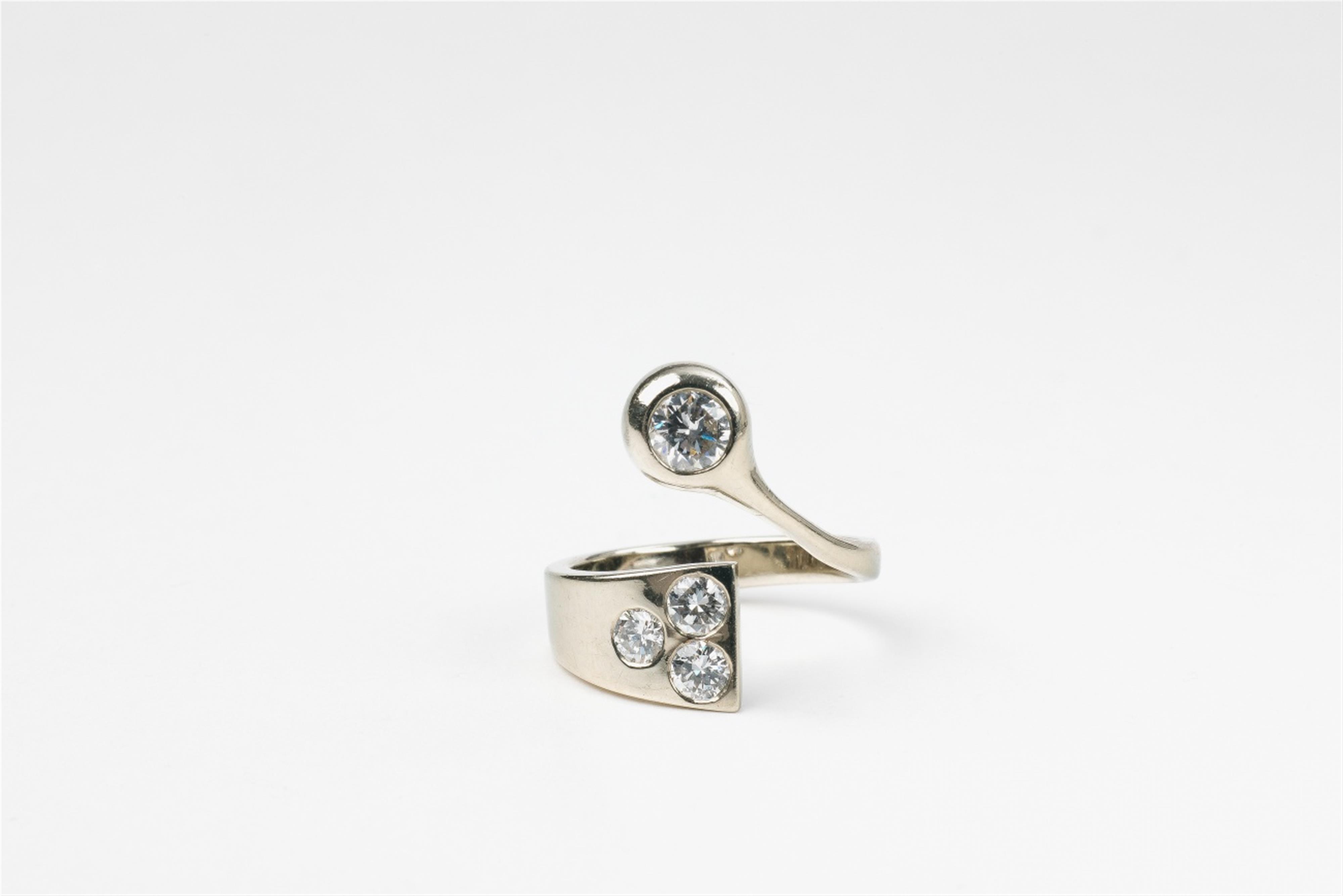 An 18k white gold and diamond crossover ring - image-1