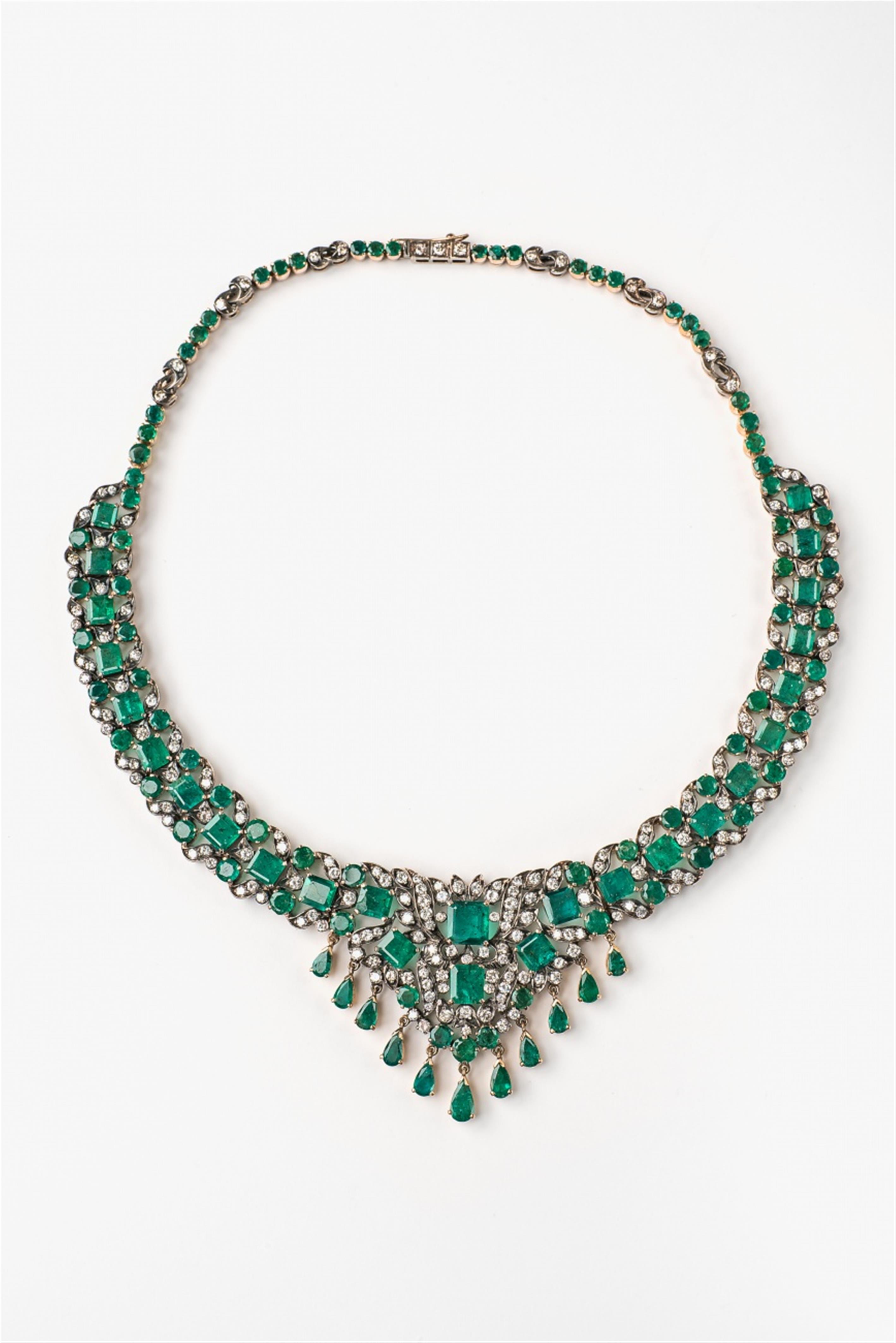 A 14k gold emerald and diamond necklace - image-1