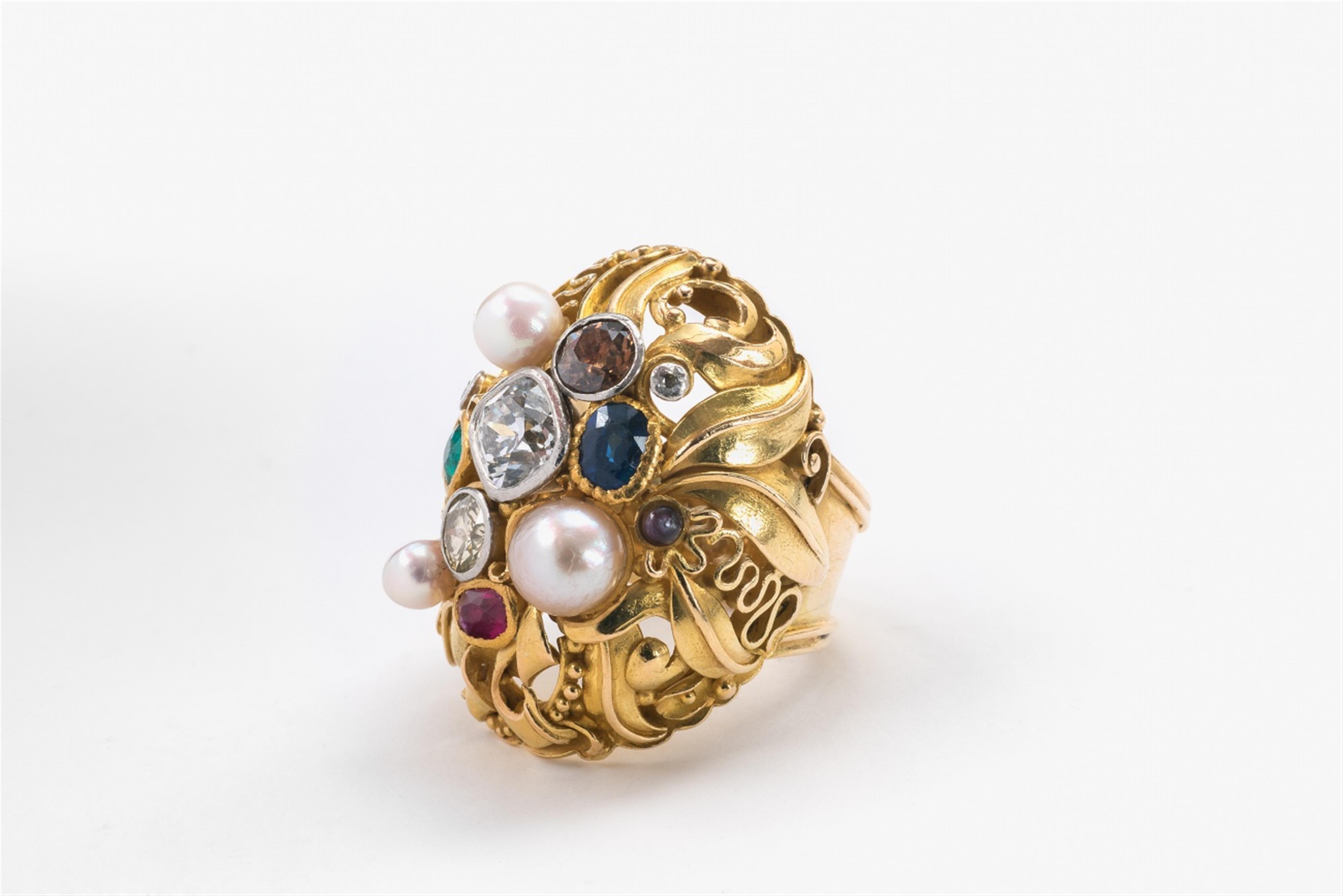 An 18k gold and gemstone ring - image-2