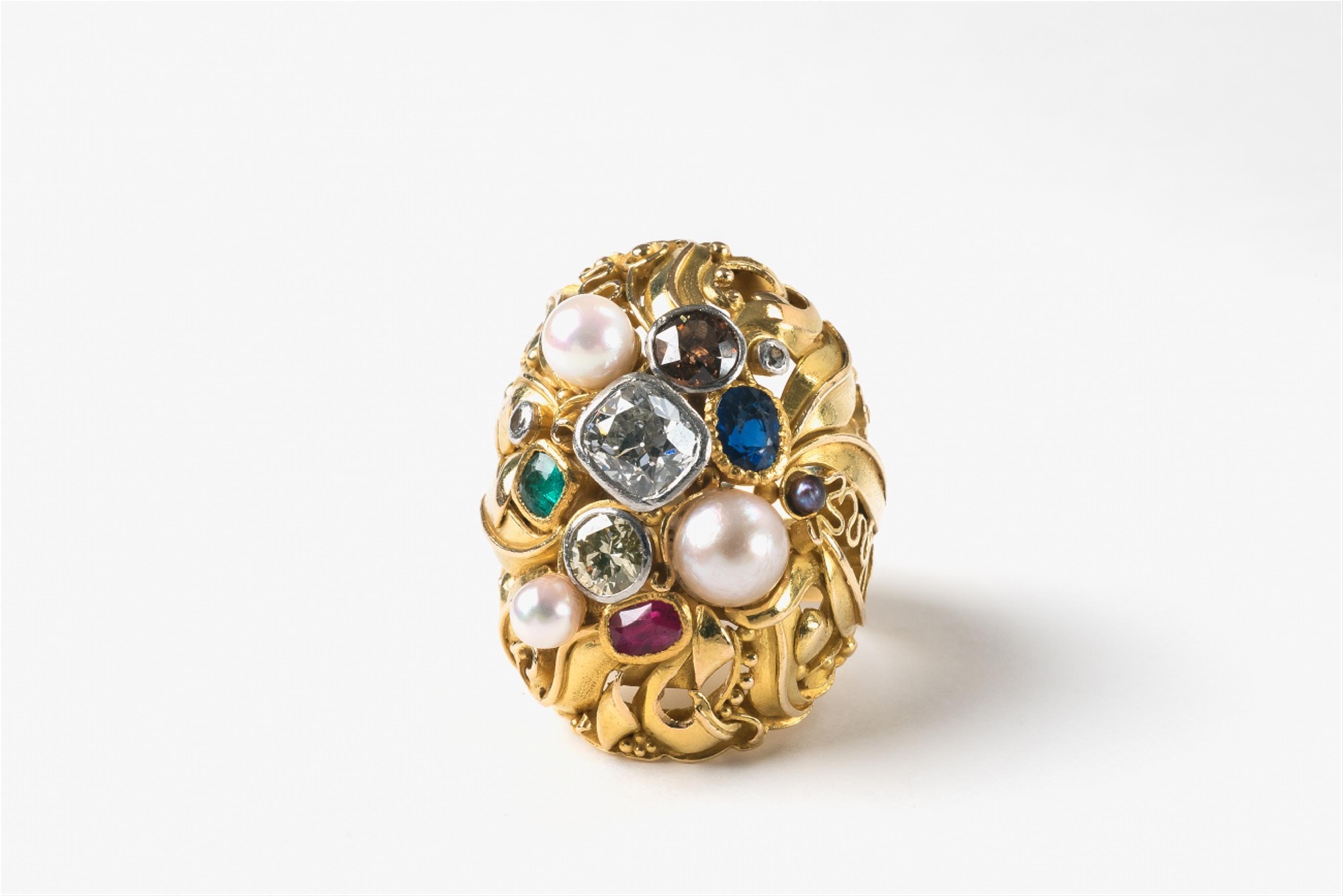 An 18k gold and gemstone ring - image-1