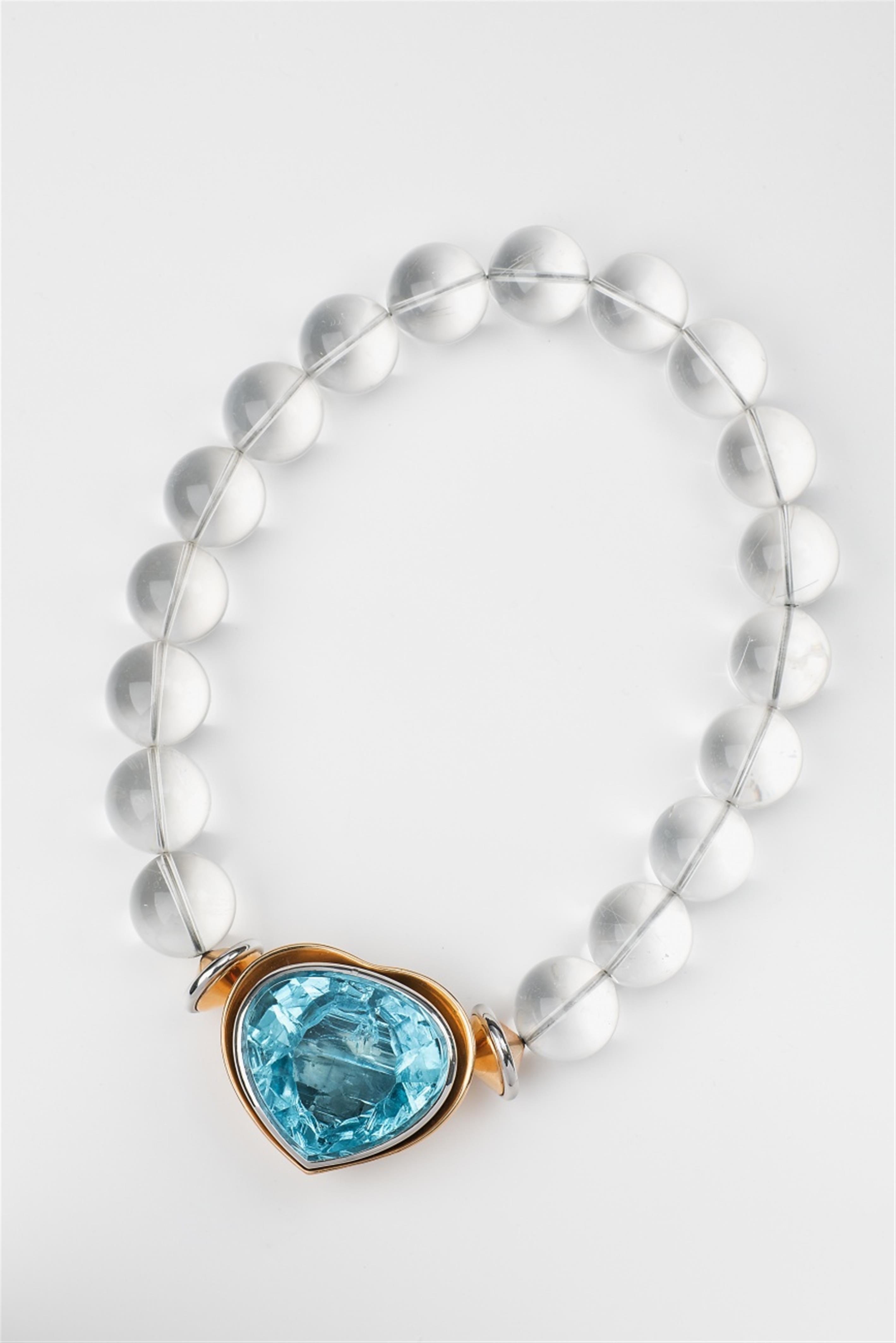 An 18k gold platinum and rock crystal necklace with an aquamarine heart - image-1