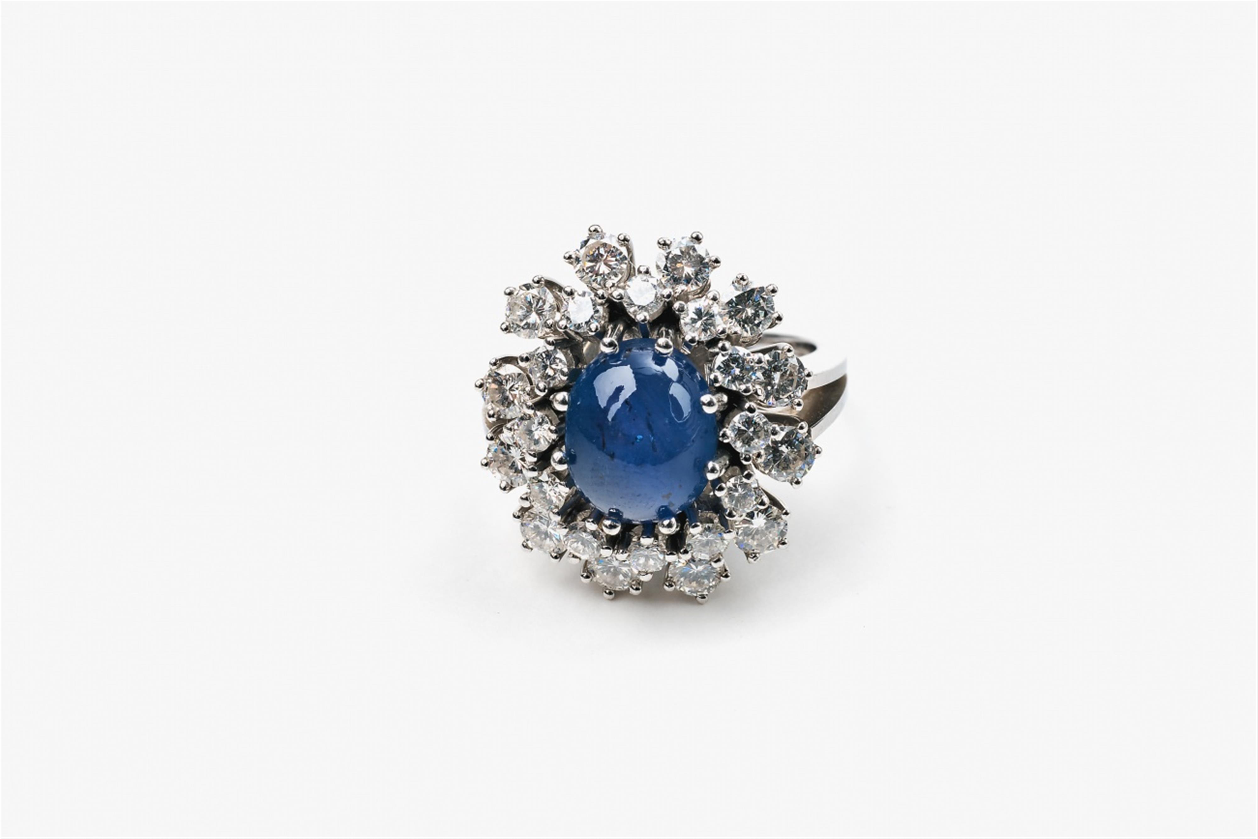 An 18k white gold and star sapphire ring - image-1