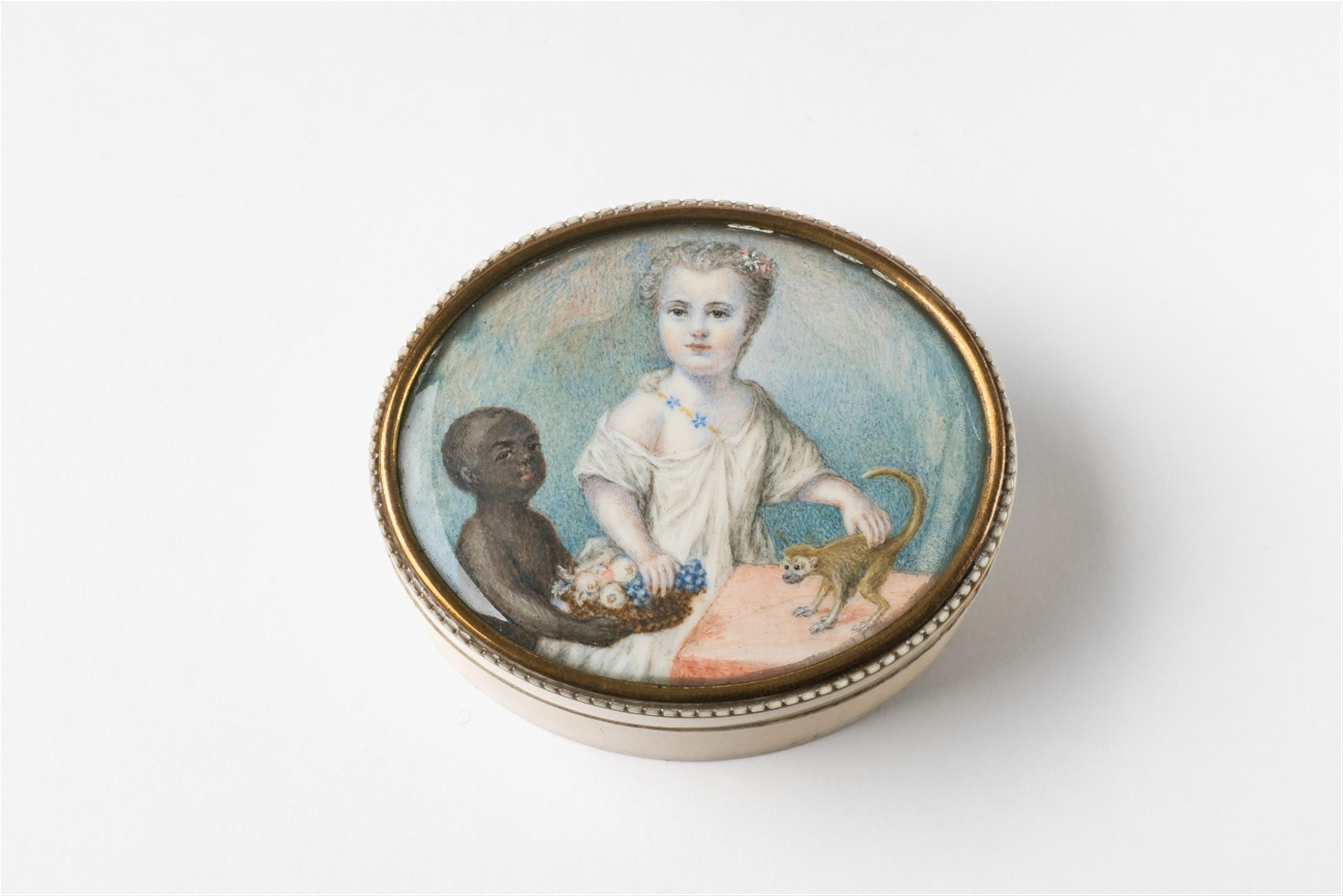 An ivory box with a portrait of a child - image-1