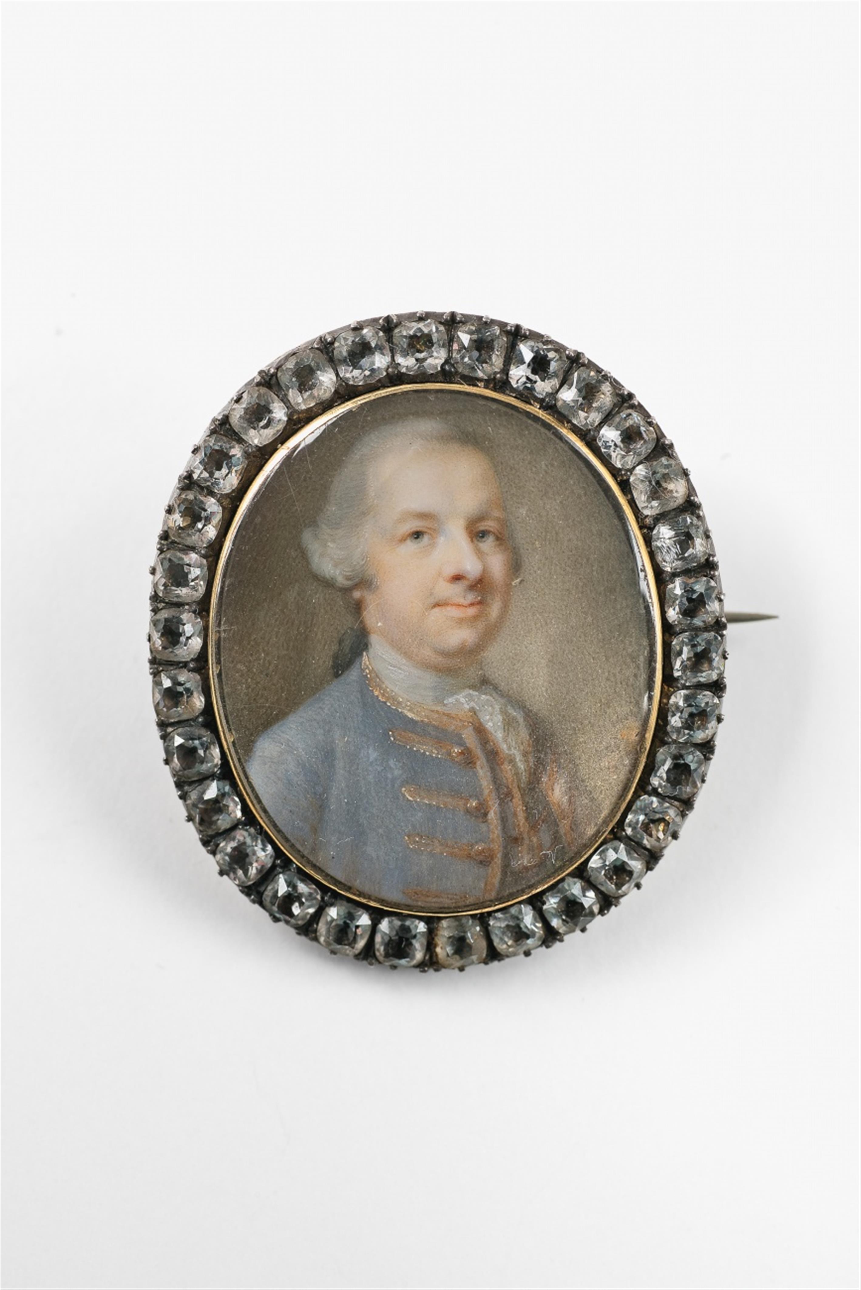 A portrait miniature of a gentleman in a blue justeaucorps - image-1