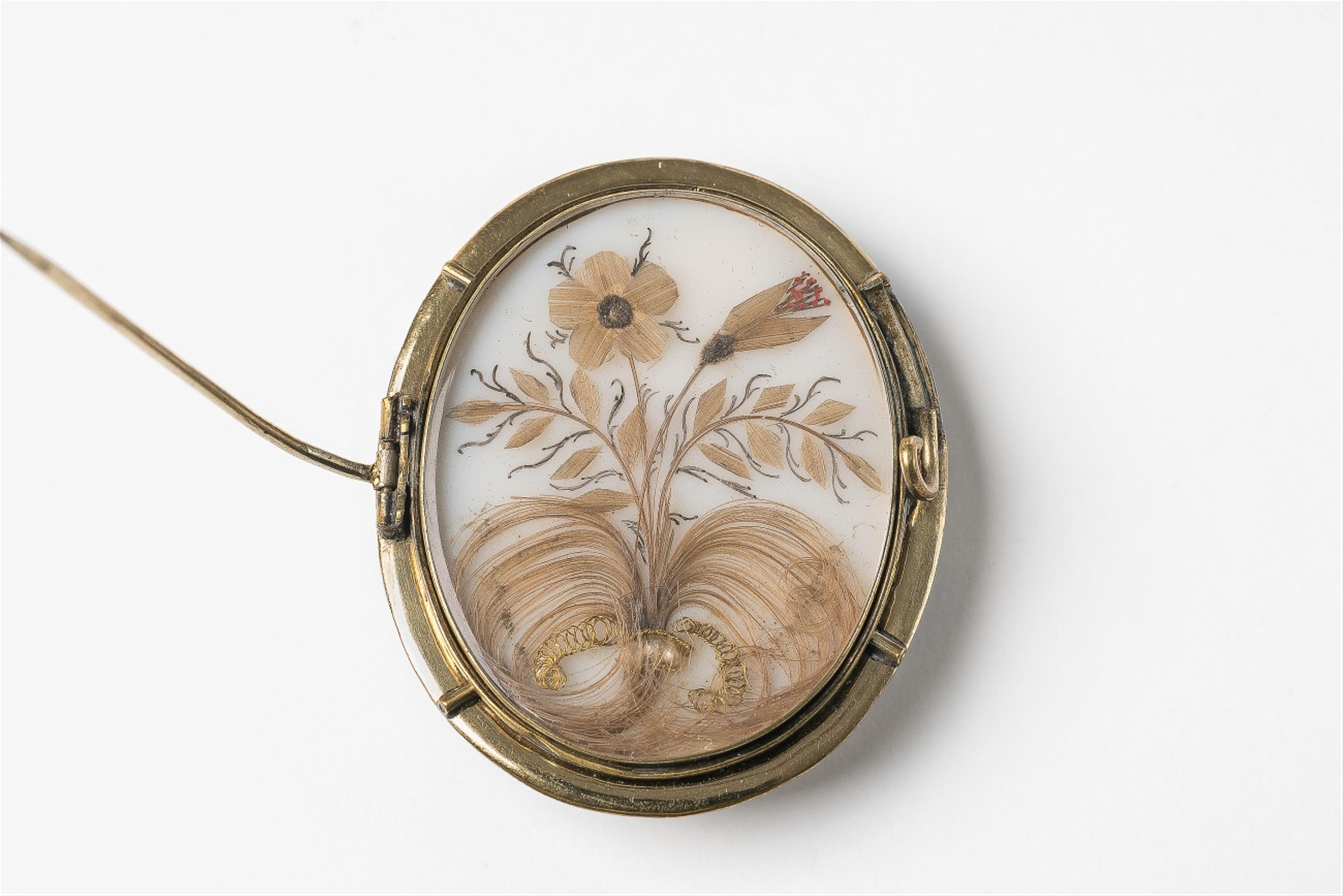A brooch with a portrait miniature of a gentleman - image-2