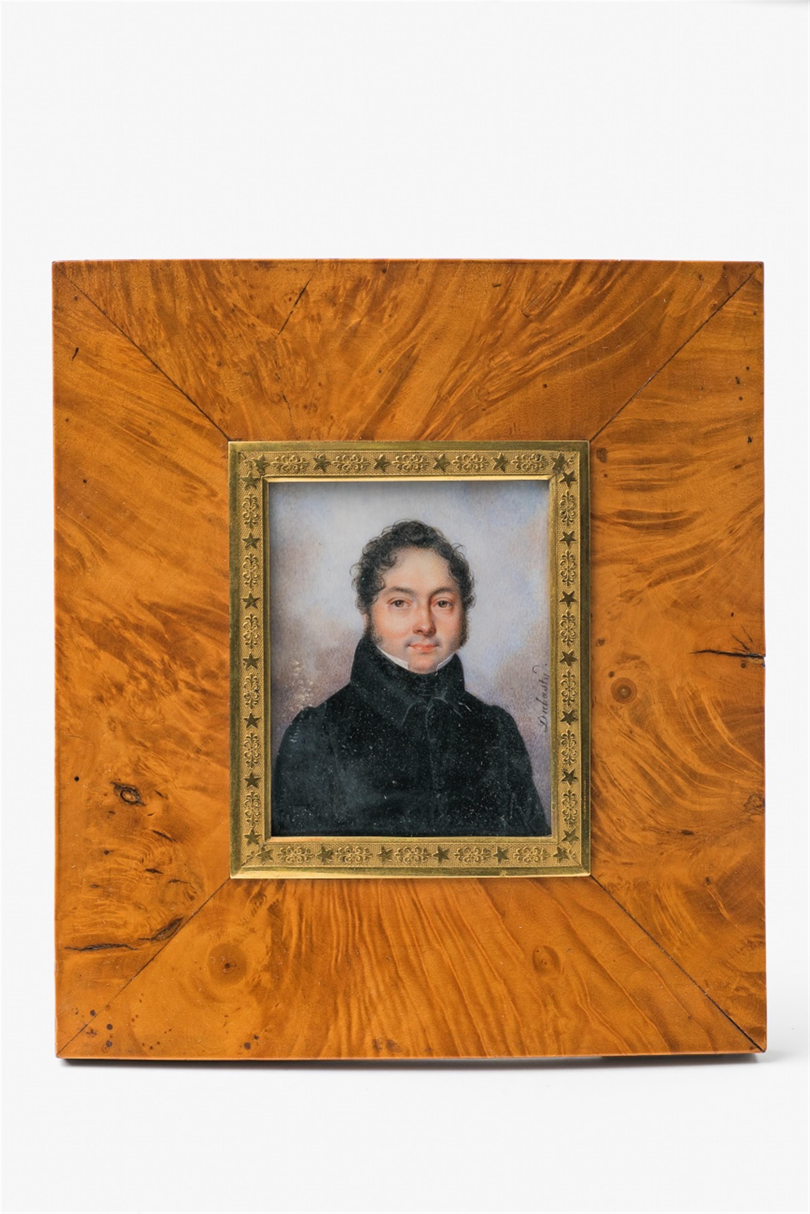 A portrait miniature of a gentleman in a dark jacket - image-1